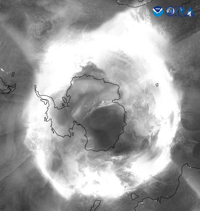 Satellite image of the north pole, showing annotated Antarctica, and the bottom of Australia, NZ and South America. A ring of white light is overlaid on the image, showing the location and intensity of the aurora.