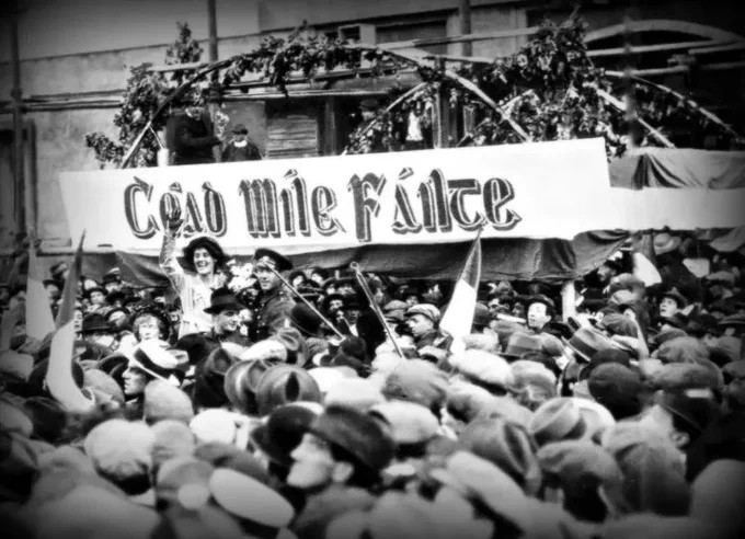 A photo of a crowd welcoming Constance Markievicz at an Irish political rally.