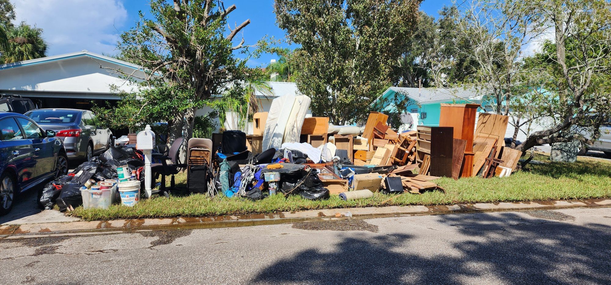 Appliances and furniture destroyed in storm surge from Hurricane Helene on the lawn