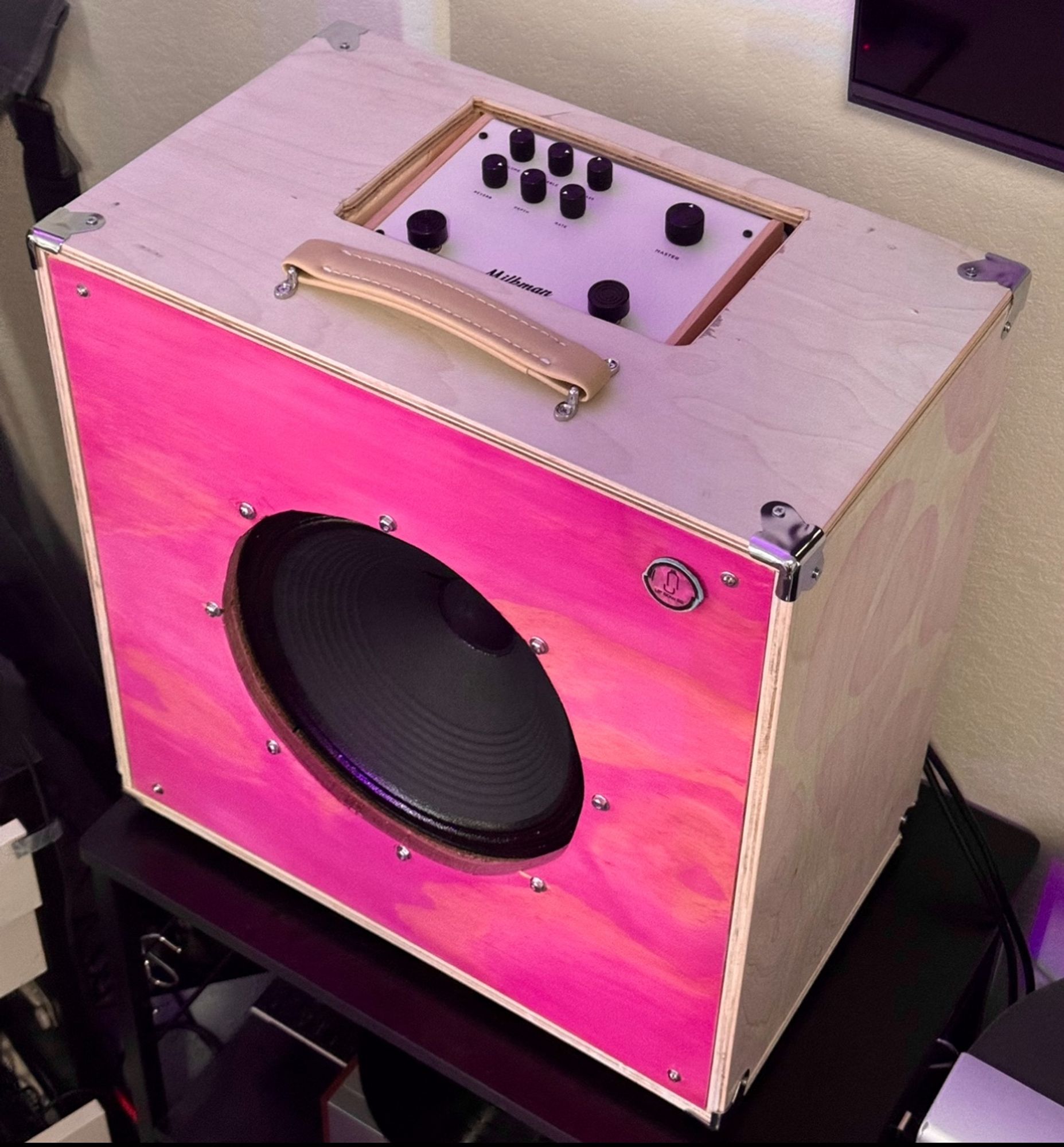 Pink front speaker cabinet open faced. 12” Celestion neo cream 60w speaker. White stained wood on the outside with a cutout to place a milkman amp inside