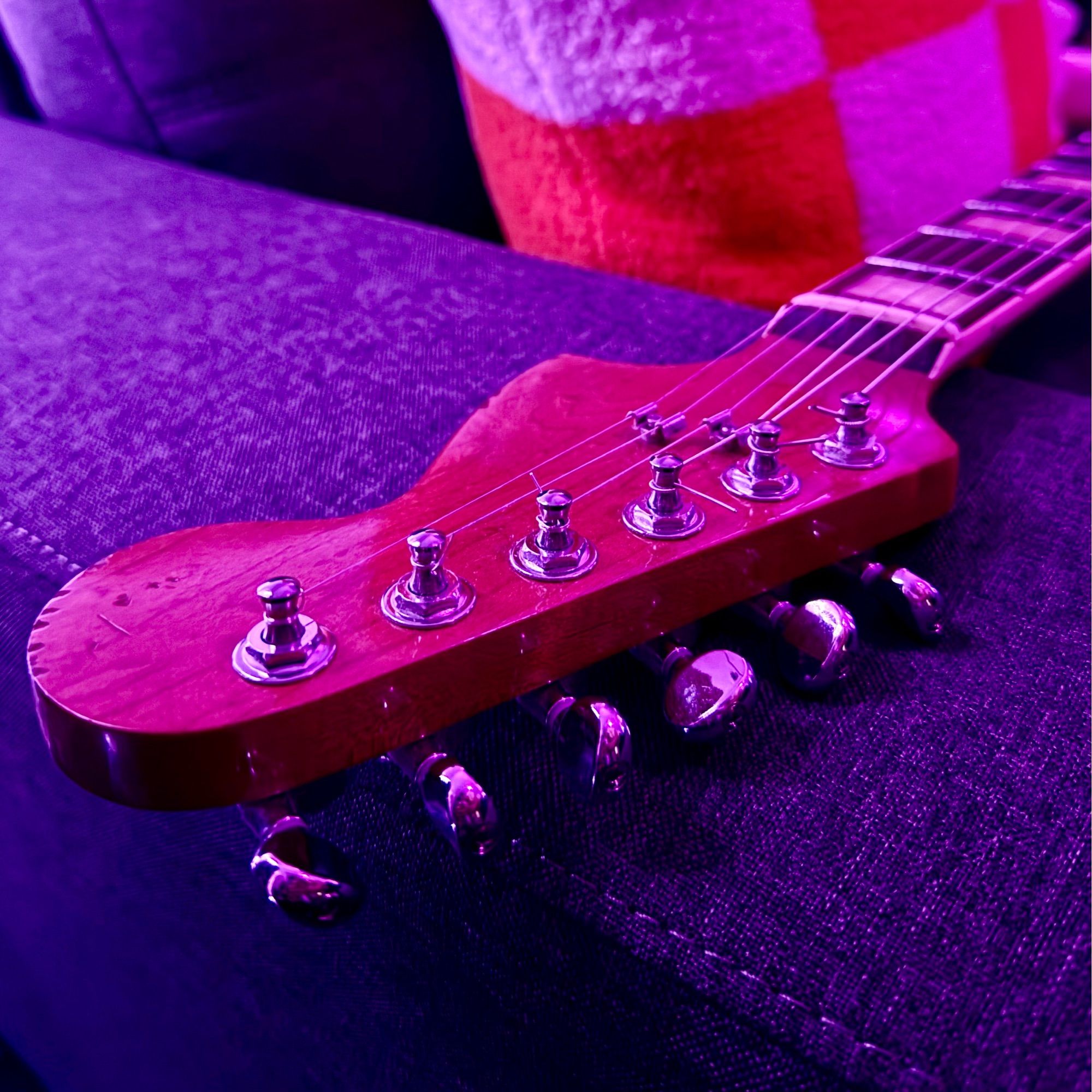 Close up of the headstock very relic looking despite being a 2019 guitar