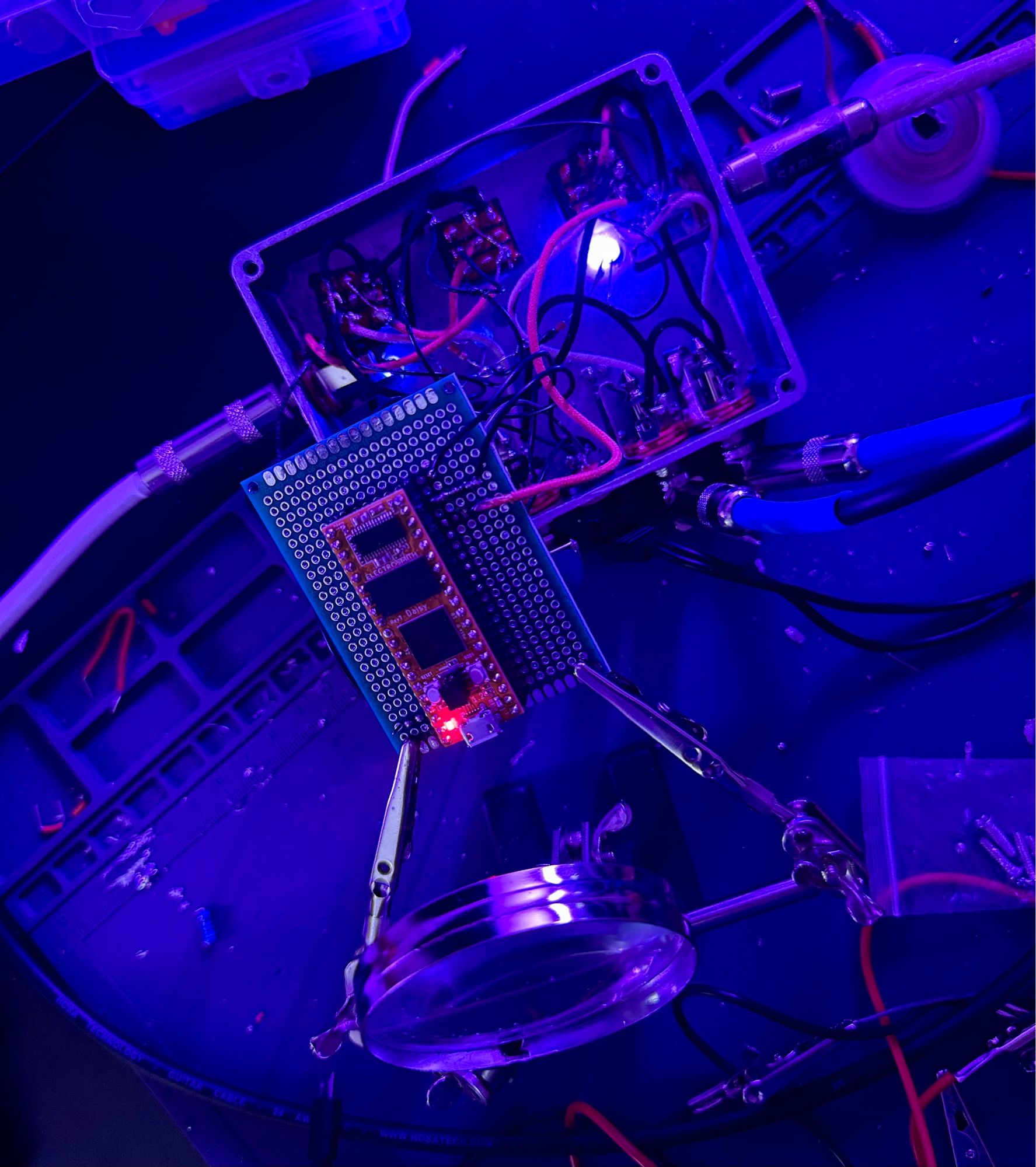 Top down view of my DIY effect loop pedal. Center of image is a daisy seed chip that allows you to program it over usb to make custom dsp