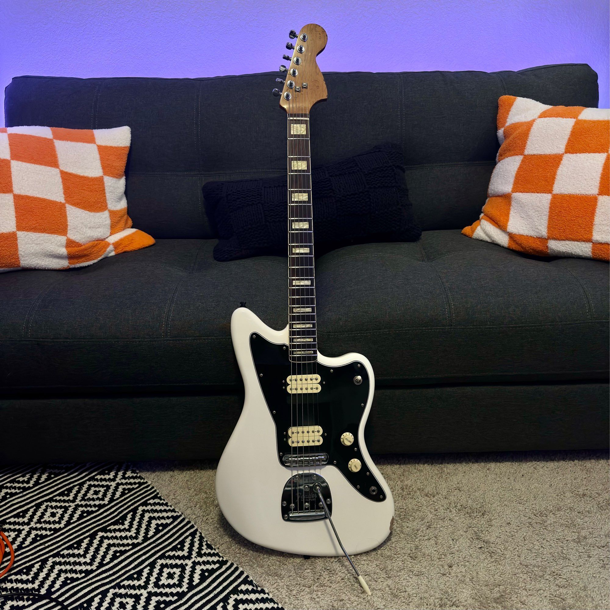 Polar white jazzmaster with two humbuckers and an upgraded bound neck with square pearl inlays