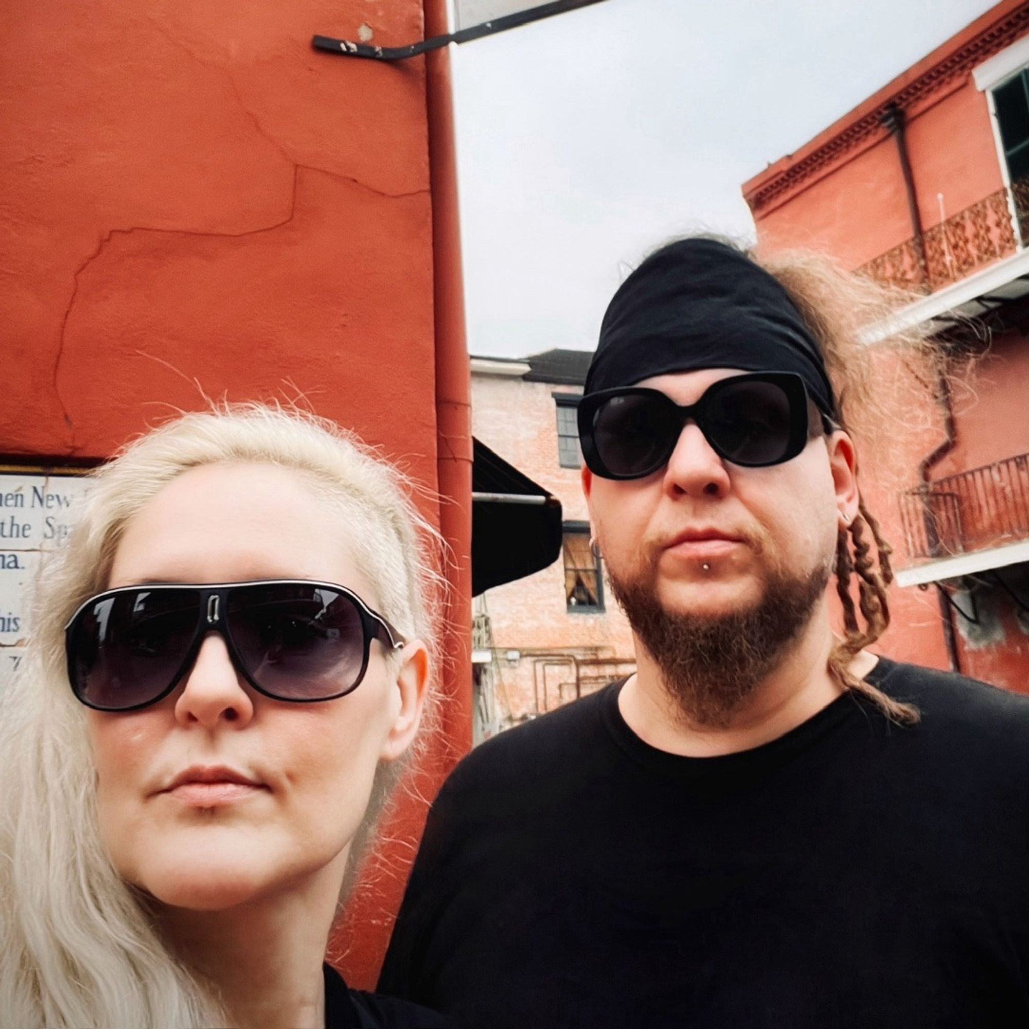 Melanie Foxfire on the left, Sco Sunset on the right. both in dark glasses. this photo was taken in New Orleans in August 2023. We are standing outside the Vampire Café in the French Quarter but you can't see the sign.