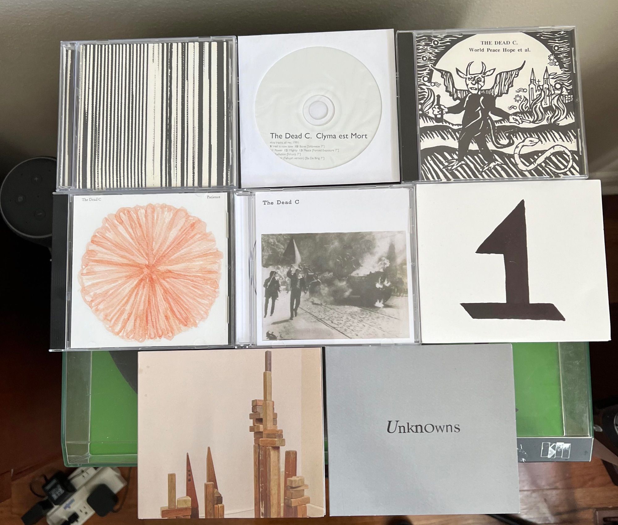 Left to right, from top:

Top row:
•Harsh 70's [sic] Reality (Siltbreeze, 1992)
•Clyma Est Mort (Proletariat Idiots, 1992 - r. Ba Da Bing!/Jagjaguwar, 2010)
•World Peace Hope Et Al. (Shock, 1994 - PDO disc with very light edge rot but hopefully there aren't any issues)

Middle row:
•Patience (Ba Da Bing!, 2010)
•Armed Courage (Ba Da Bing!, 2013)
•Trouble (Ba Da Bing!, 2016 - 2xCD)

Bottom row:
•Rare Ravers (Ba Da Bing!, 2019)
•Unknowns (Ba Da Bing!, 2020)