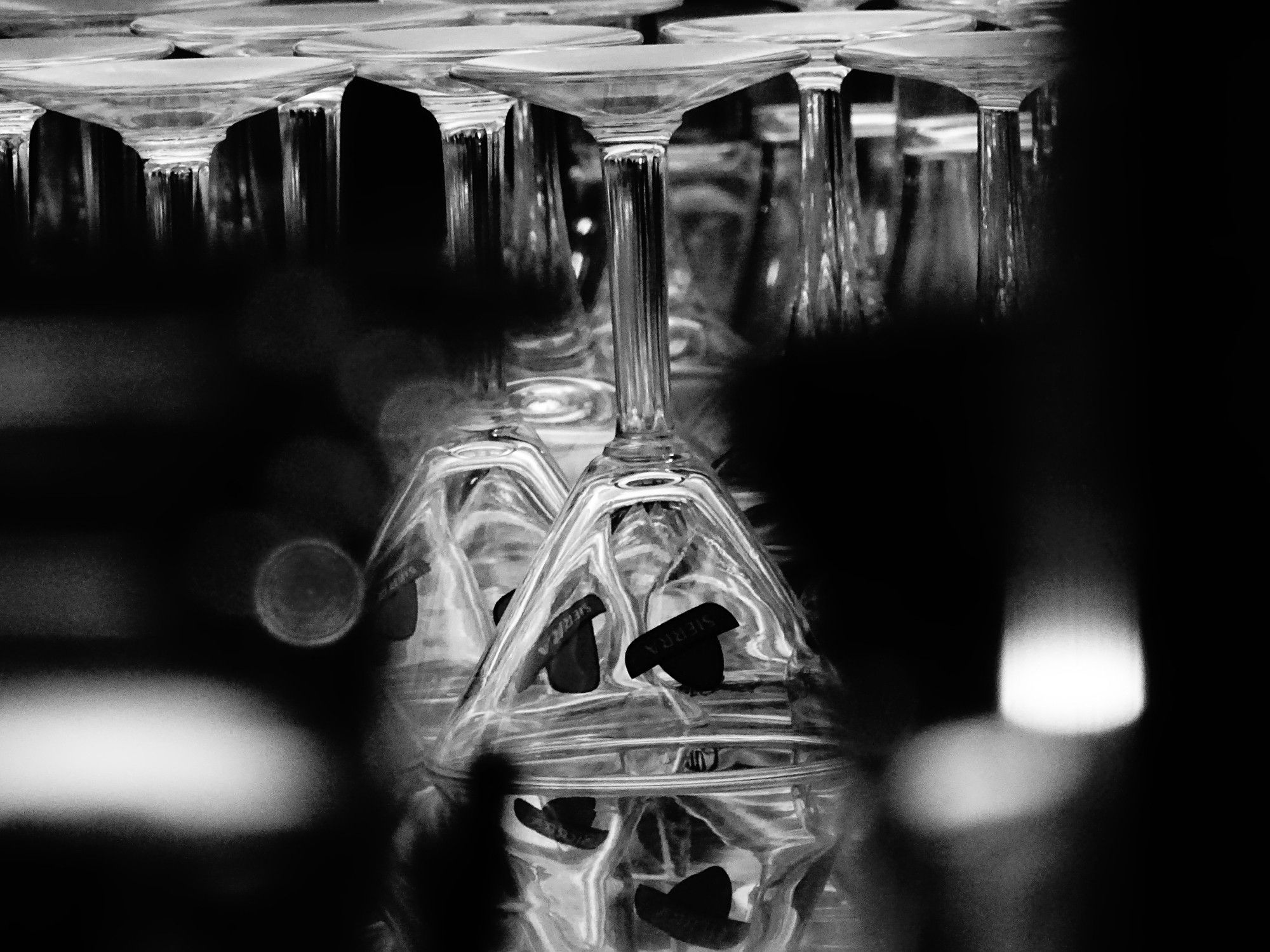 Black & white 
Glasses in a bar.