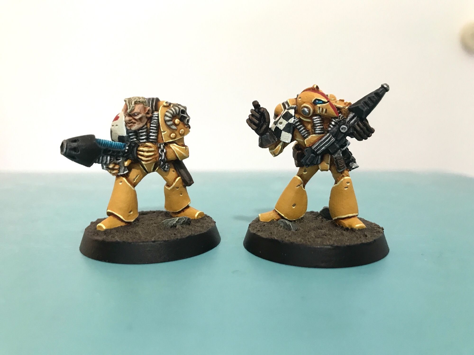 2 old Warhammer 40k Space Marines, painted yellow.