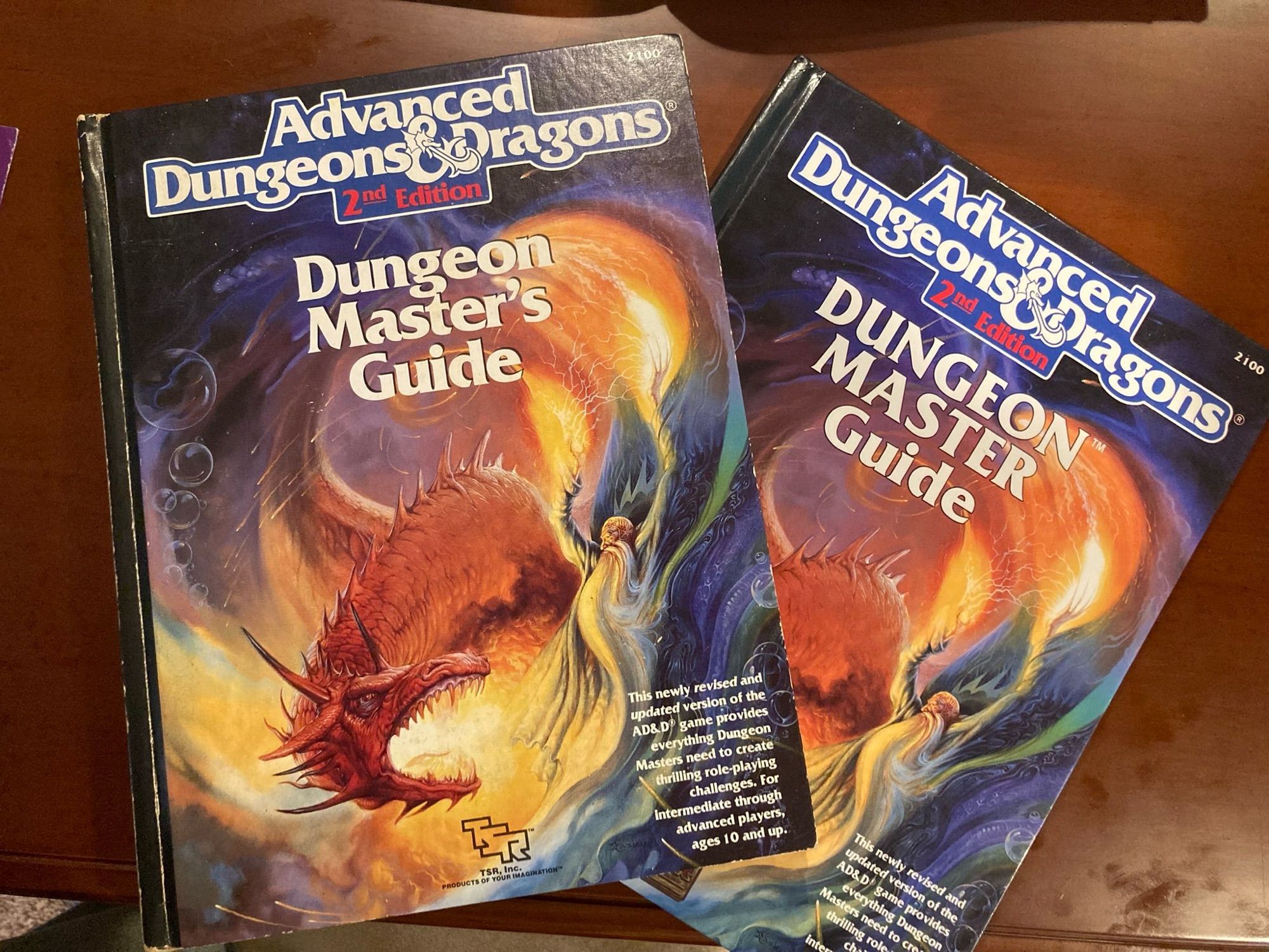 AD&D 2nd edition DMG covers with different title text