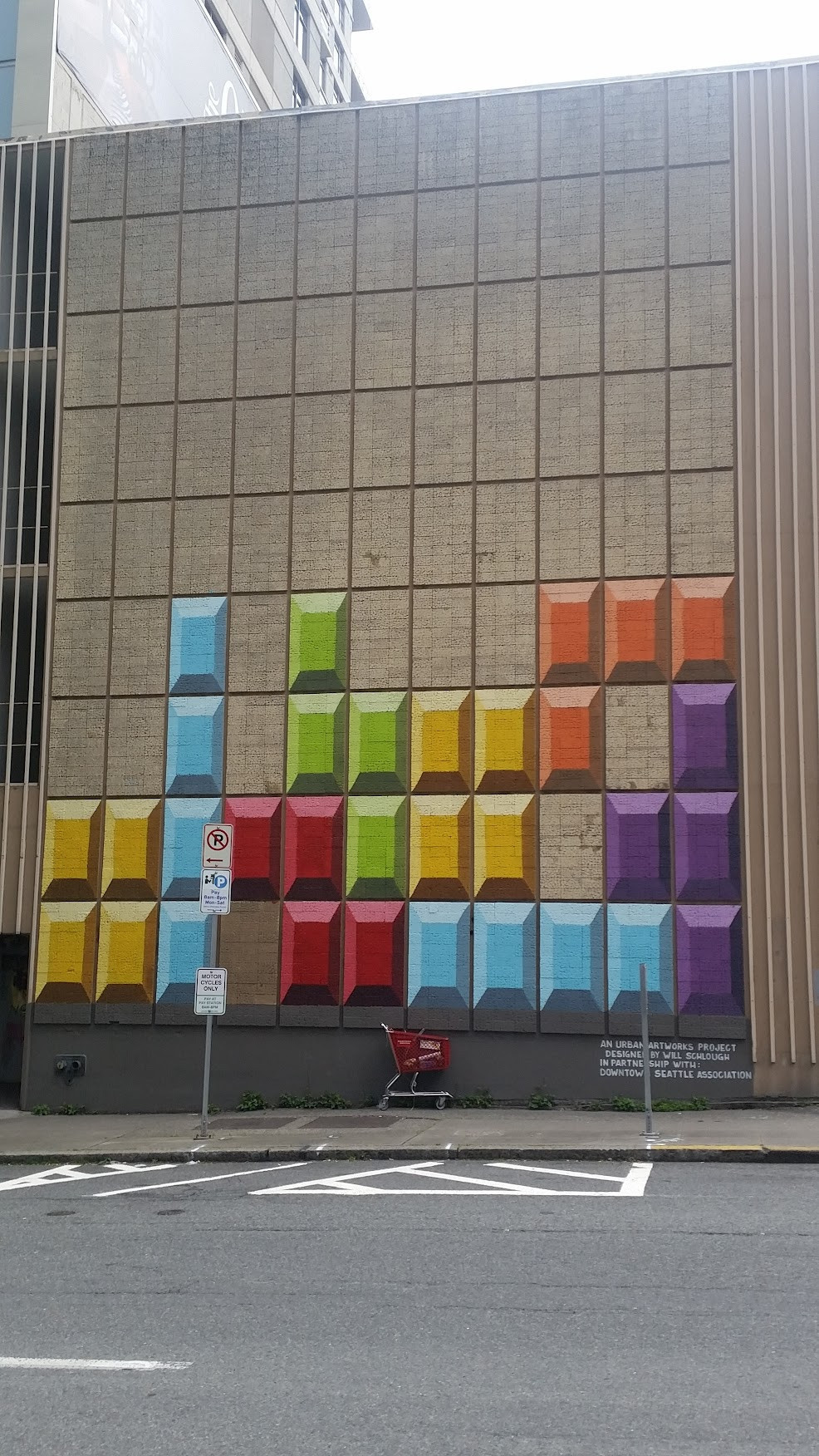 A wall in downtown Seattle onto which someone has painted a Tetris board 40 feet high.