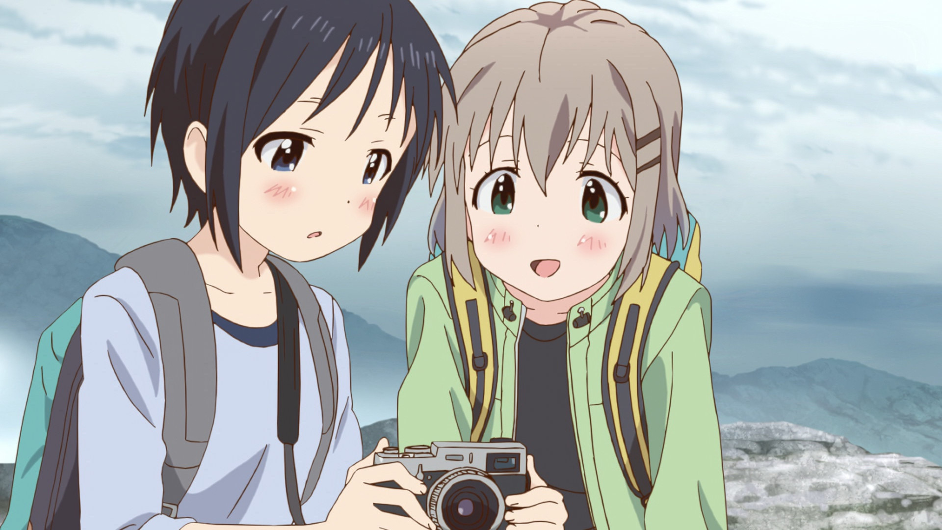 Honoka showing Aoi her pictures from the anime series Encouragement of Climb Season 2.