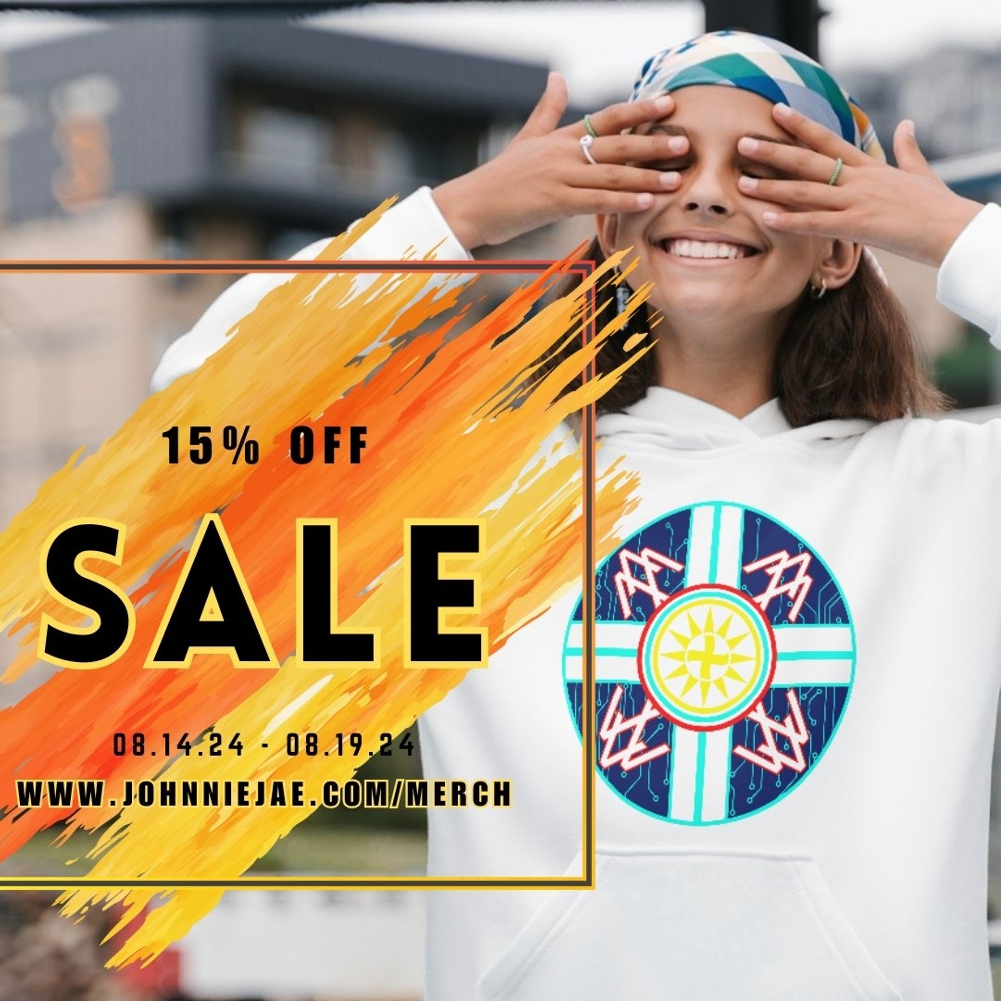 A young girl wearing a scarf over her hair is wearing a white hoodie with the Strength & Pride Design, a shield that features 4 thunderbirds surrounding the choctaw sun symbol. Text reading 15% OFF SALE, 8.14 - 8.19. www.johnniejae.com/merch is written over a bright yellow and orange splatter of paint with a square around it.