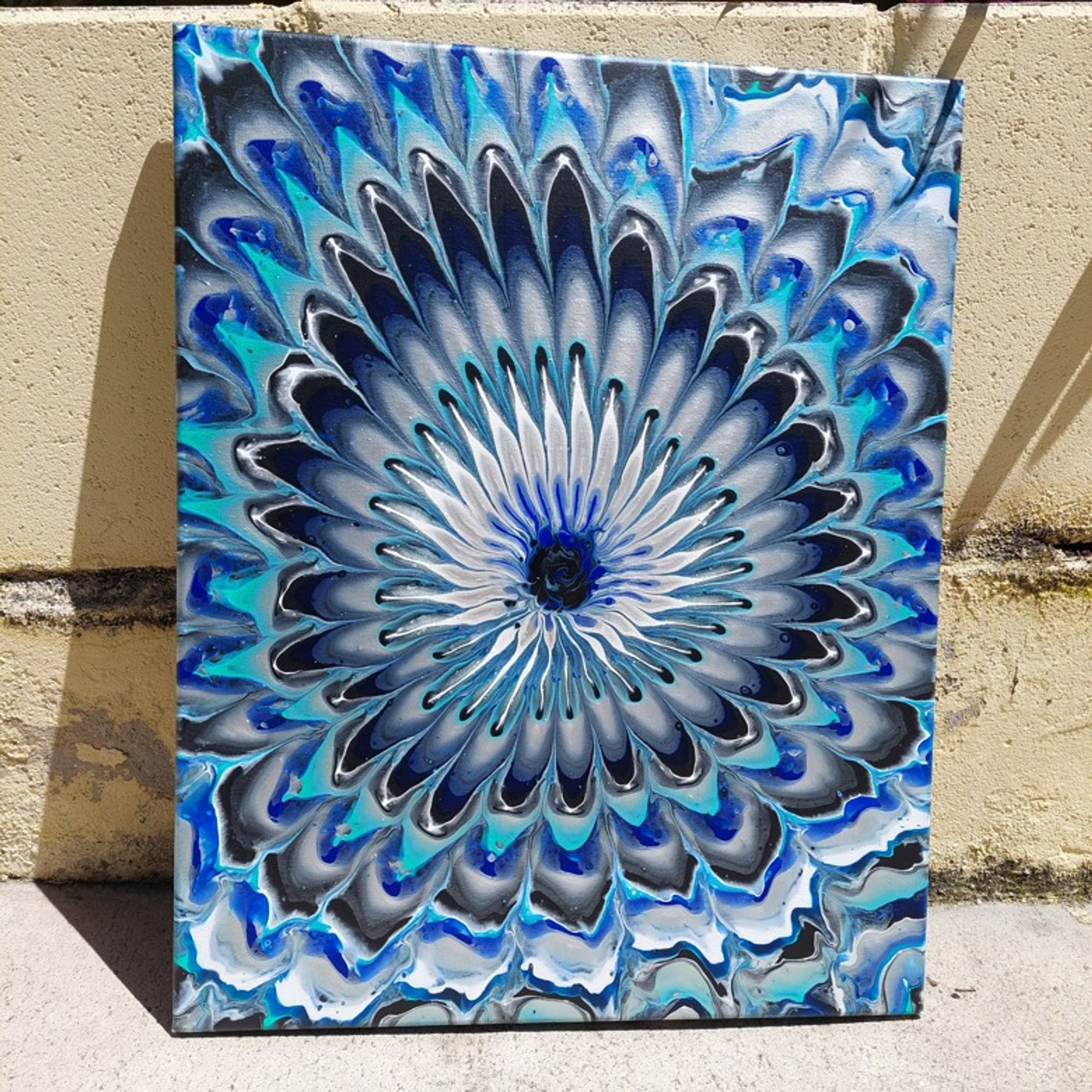 16in x 20in Acrylic Canvas. "Flowers Dressed in Blue: A mesmerizing abstract bloom of delicate petals adorned in teal, ultramarine blue, white, silver and black.