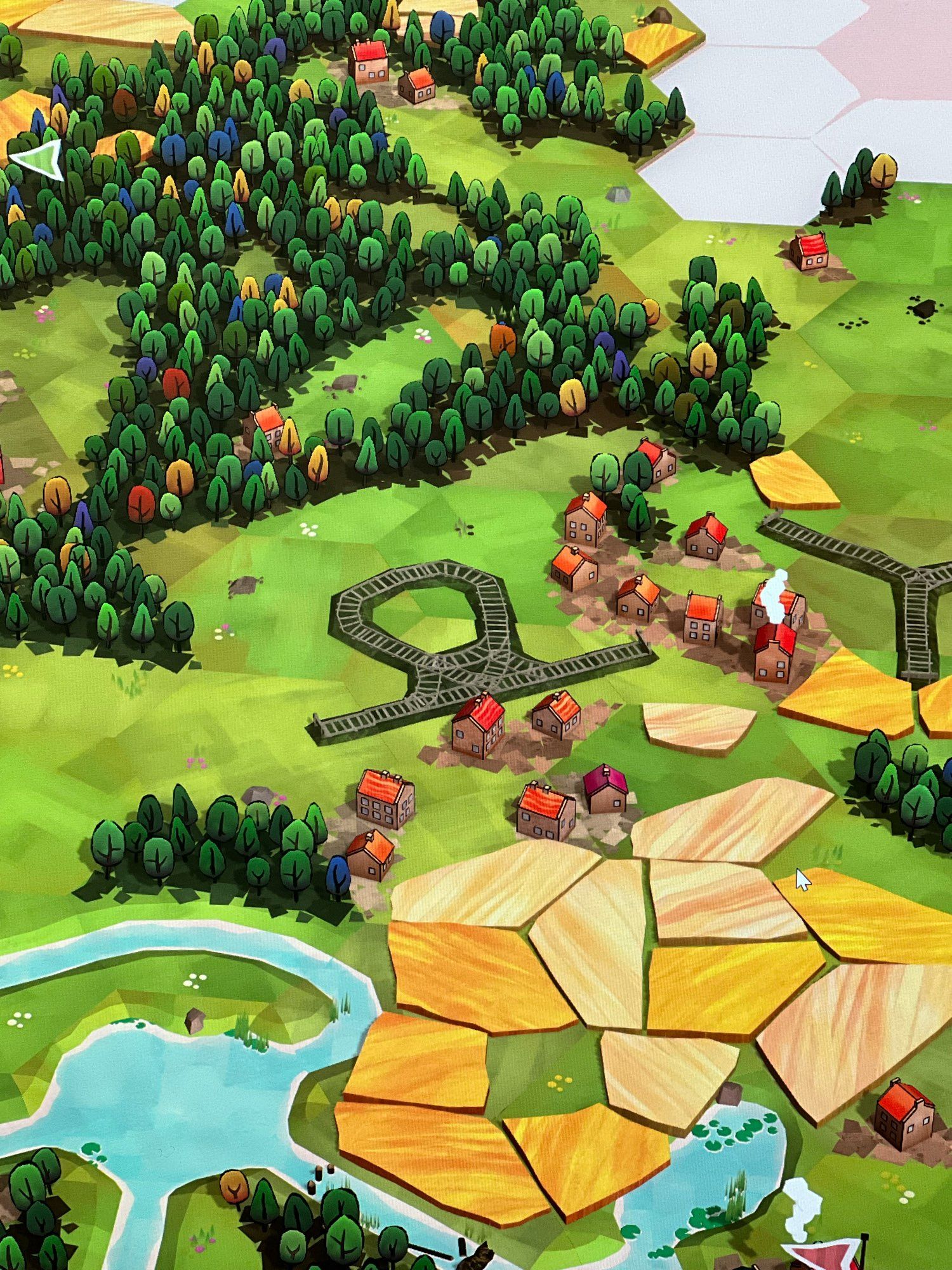 Screenshot of the game Dorfromantik featuring a railroad that it two ends and a loop over only a handful of tiles