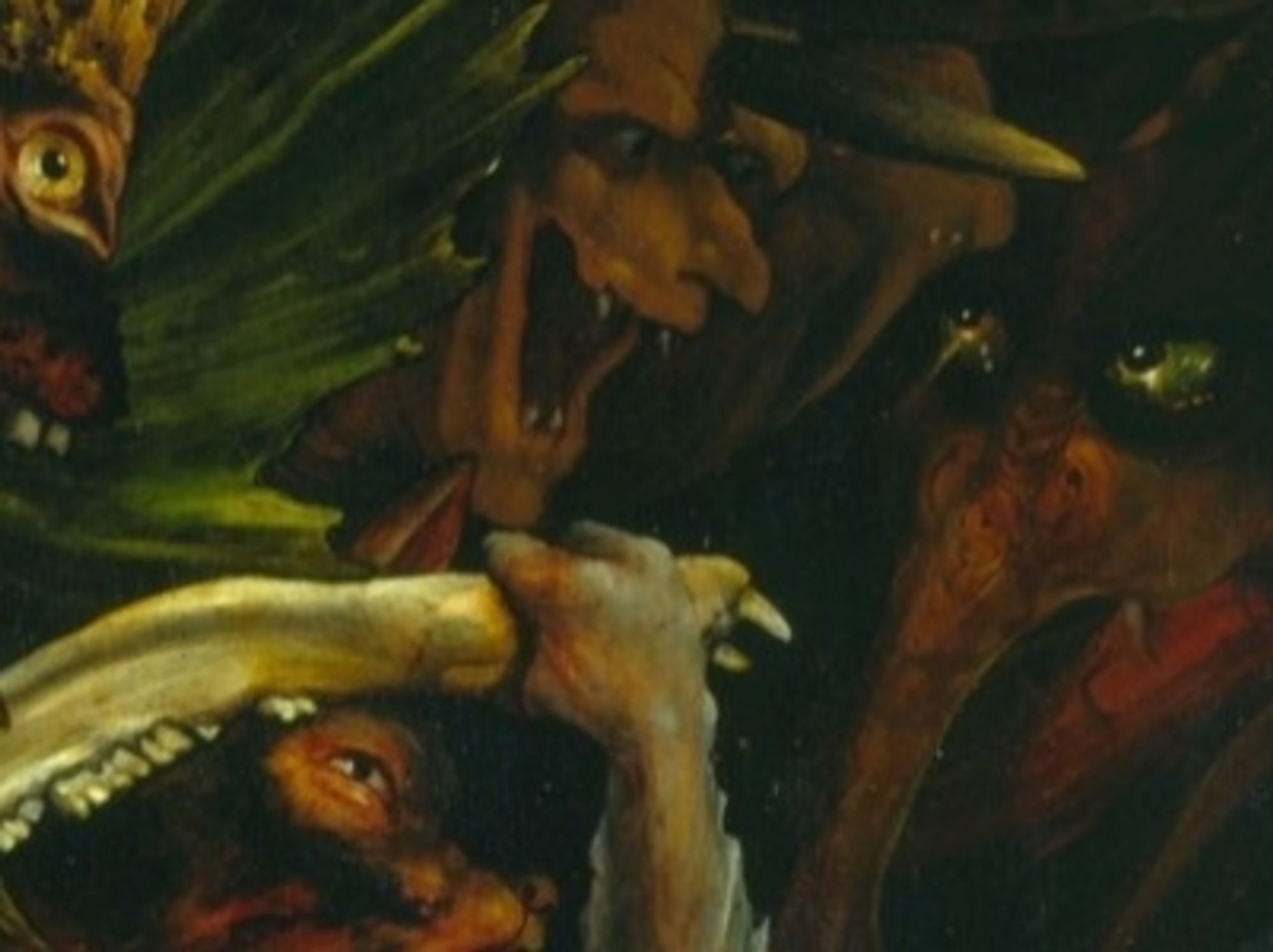 Detail from one panel of the Isenheim Altarpiece, painted in 1512-1516.
It shows some of the demons tormenting   Saint Anthony. Those are the demons that are less visible, those that lurk in the shadows behind the saint. A total of six eyes belonging to four demons are shown here, all of them mean, two of them green.