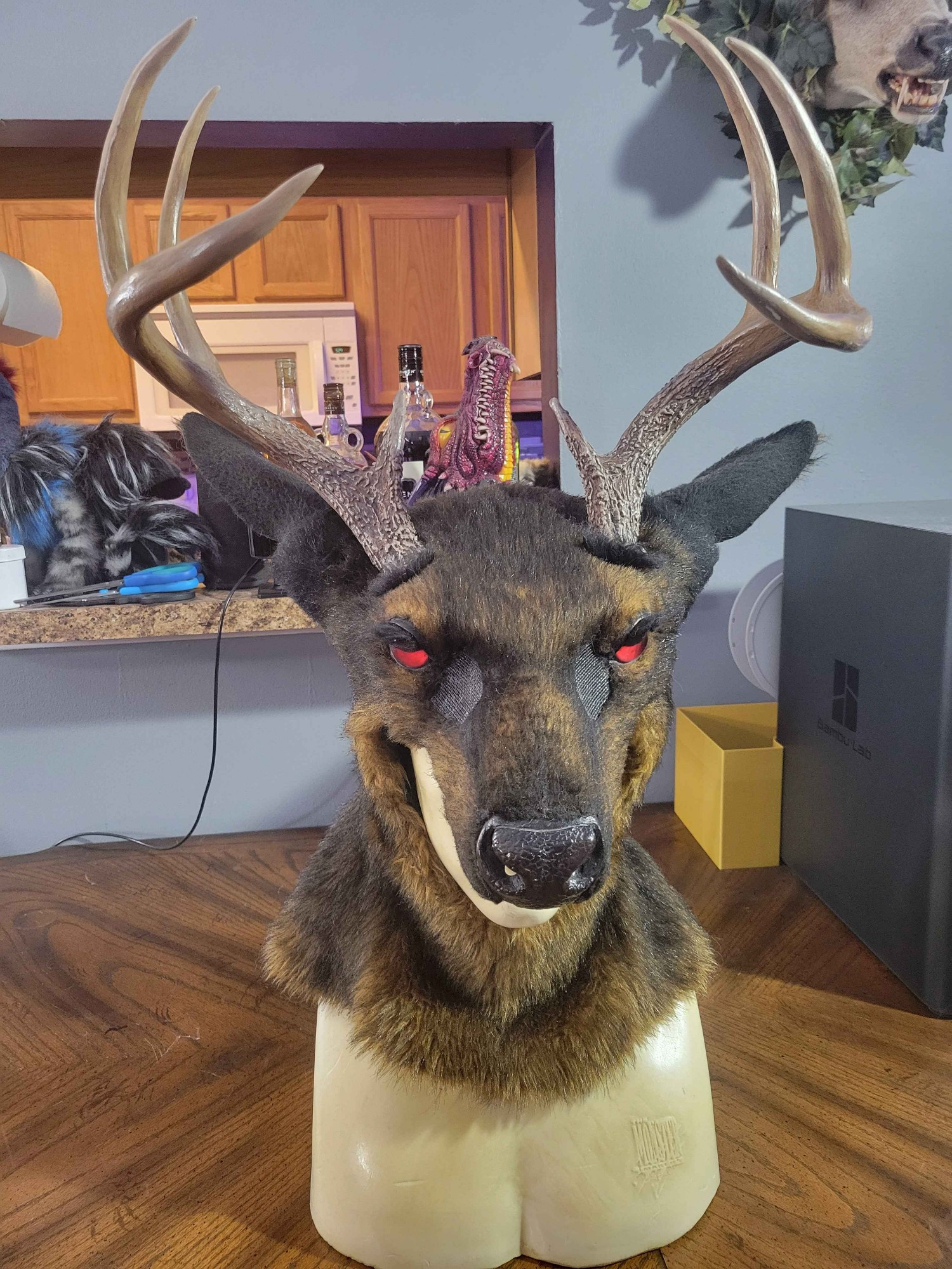 Stag half mask pulled down over mannequin face