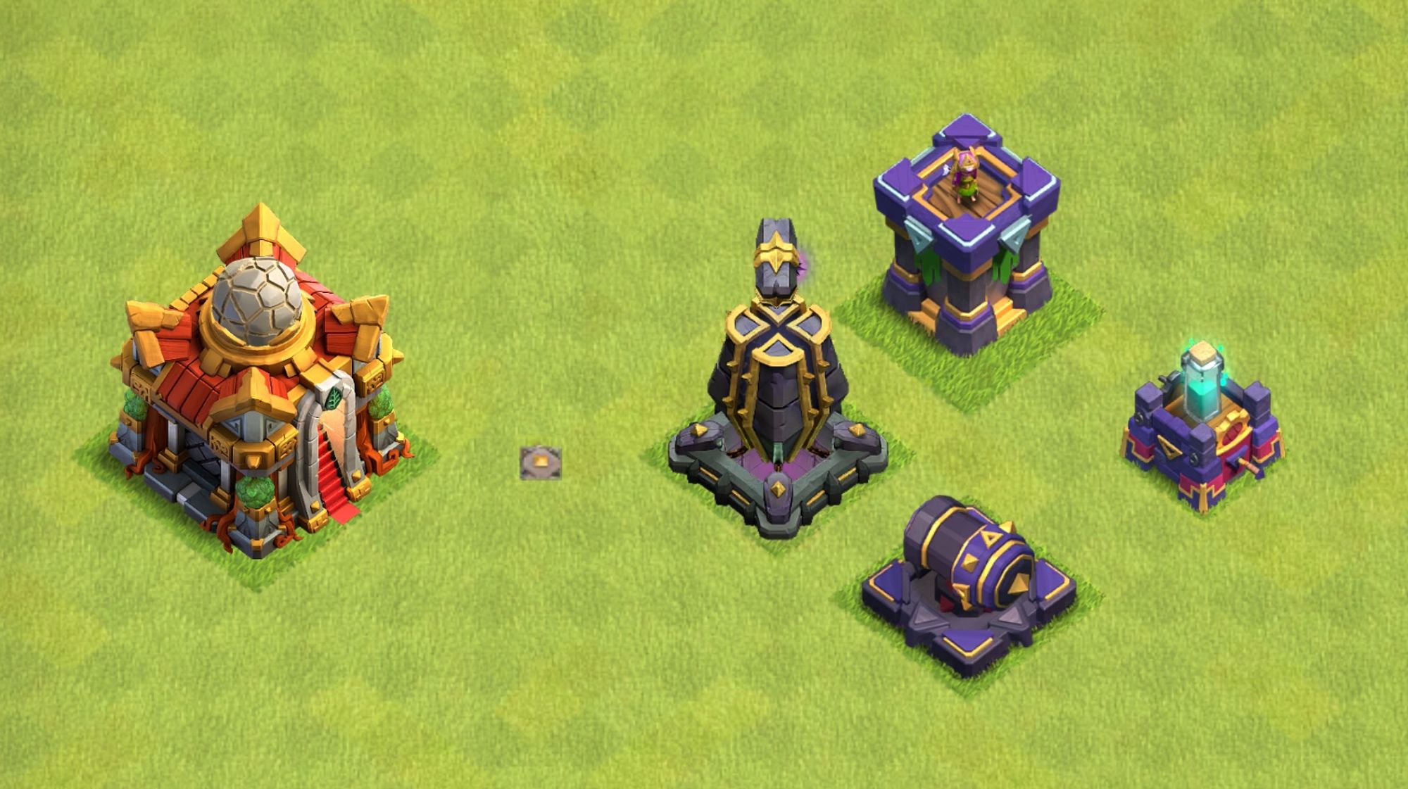 A level 16 town hall and a monolith, an archer tower, a cannon, and a spell tower - all with TH 15 design despite being at the currently maximum level