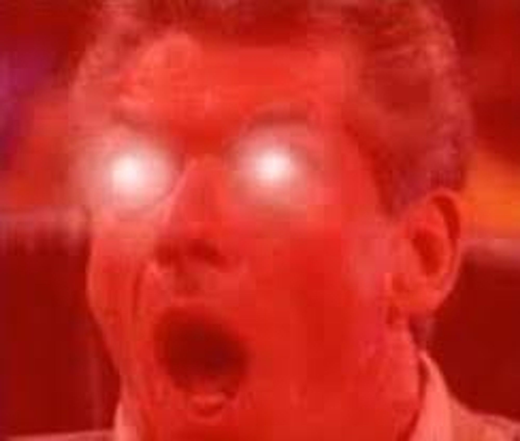 The McMahon meme with red glowing eyes.