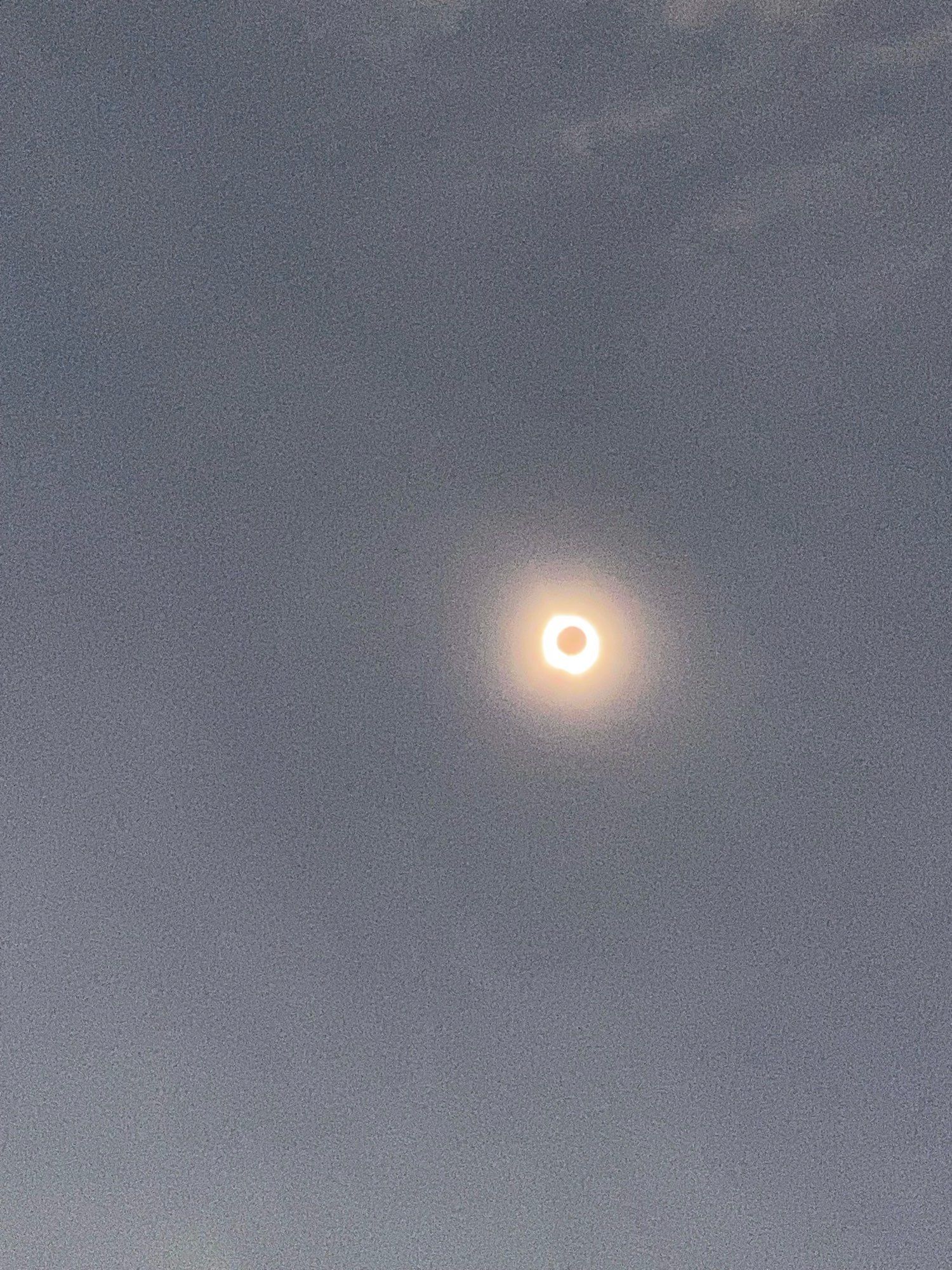 full solar eclipse, camera quality makes it look like it’s on fire (in a cool way)