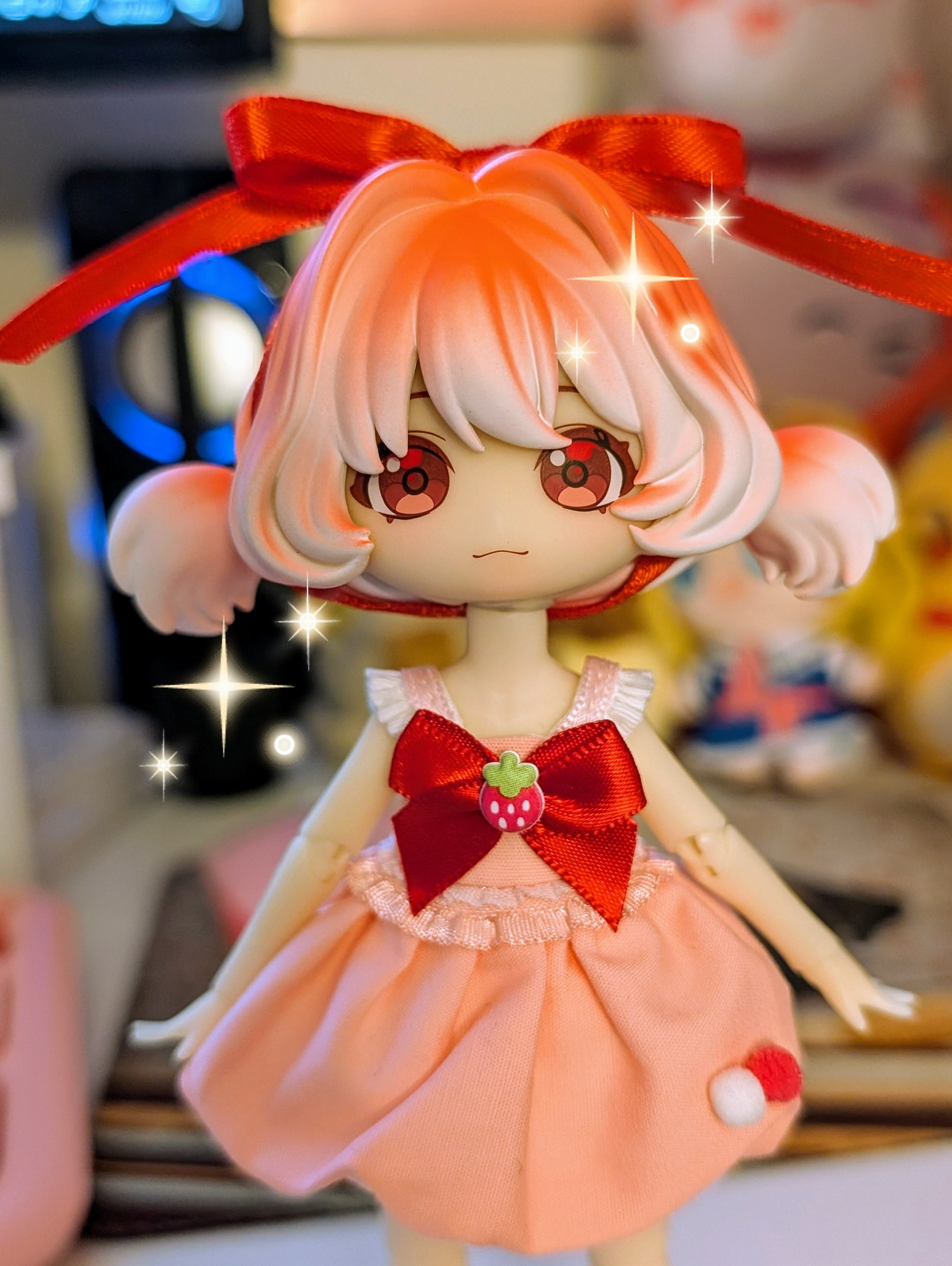 The ball jointed doll, Berries, now with a little pink strawberry on the red chest bow of her pink dress