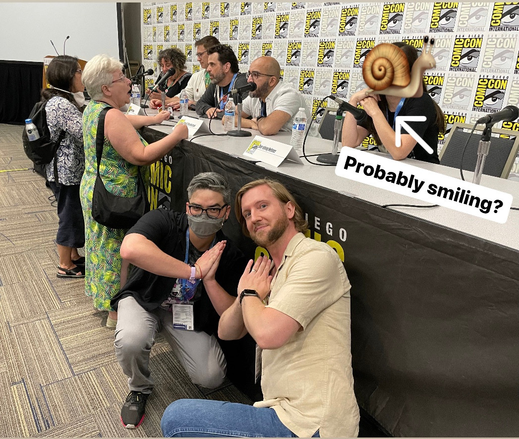 Two goofy dudes at SDCC supporting one kickass panelist.