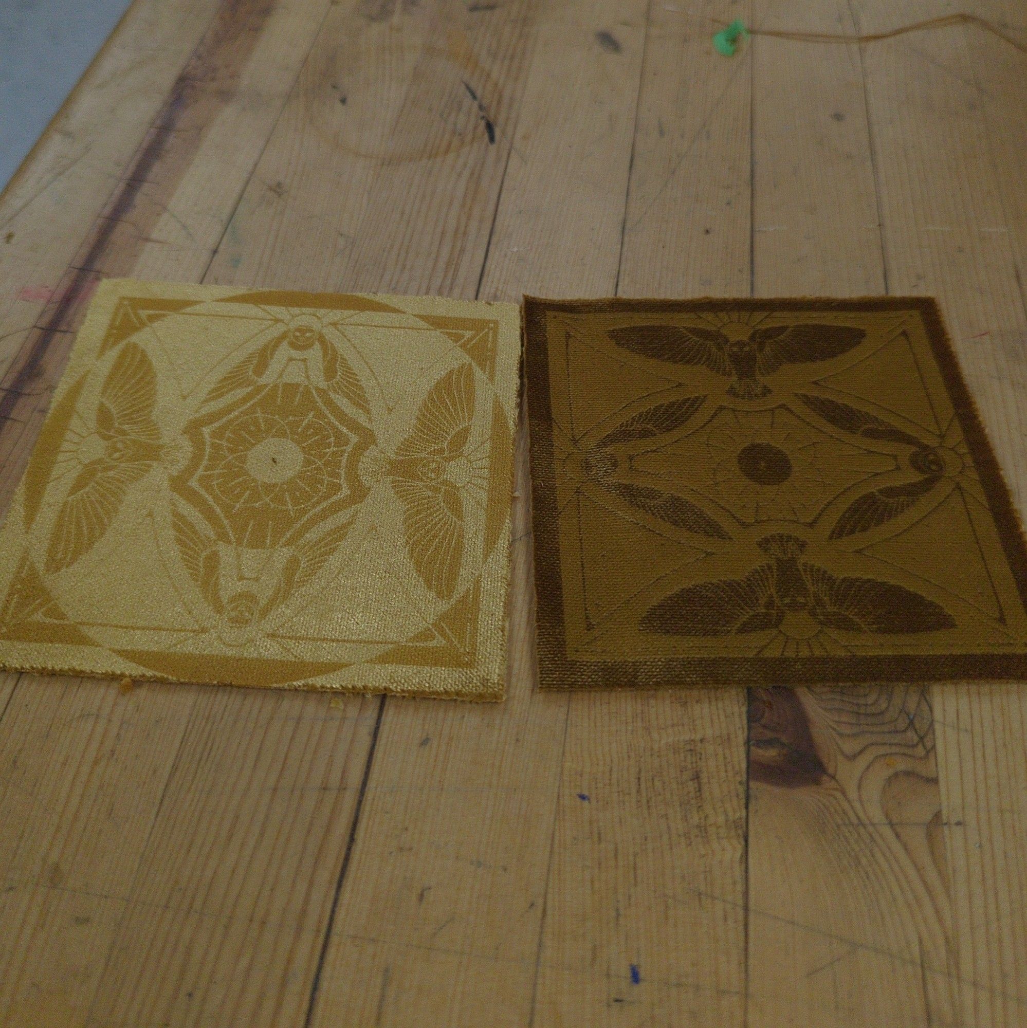 Golden velvet fabric engraved with a geometric owl design.