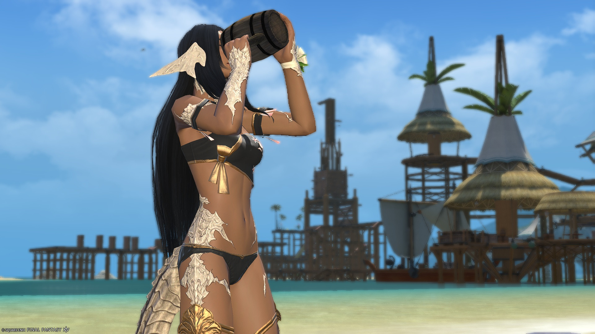 Maral Malaguld, wearing a black swimsuit with floral motifs, standing on the beach near Costal del Sol, consuming a full tankard of beer in one go.