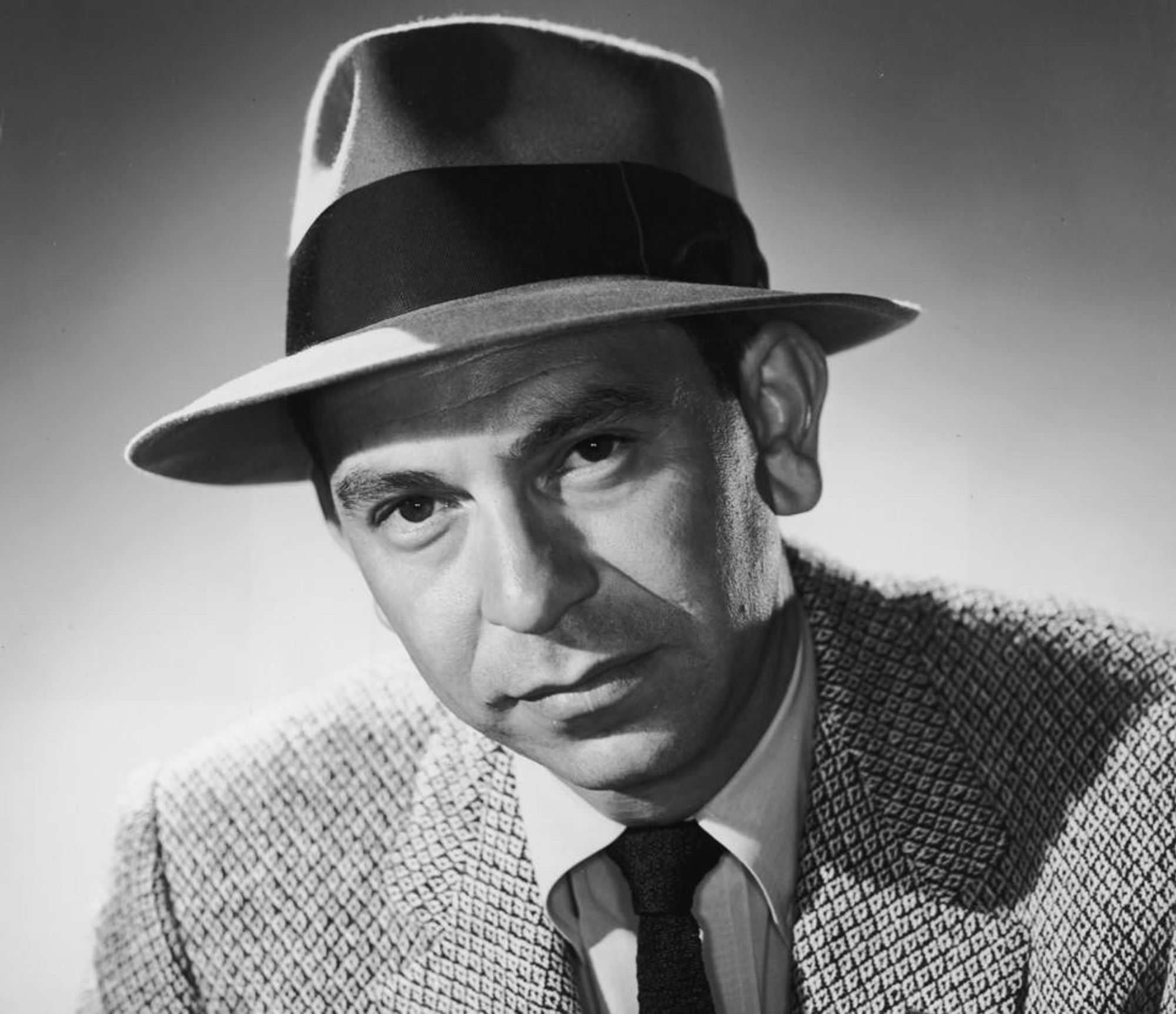 A young Jack Webb, with coat and hat 