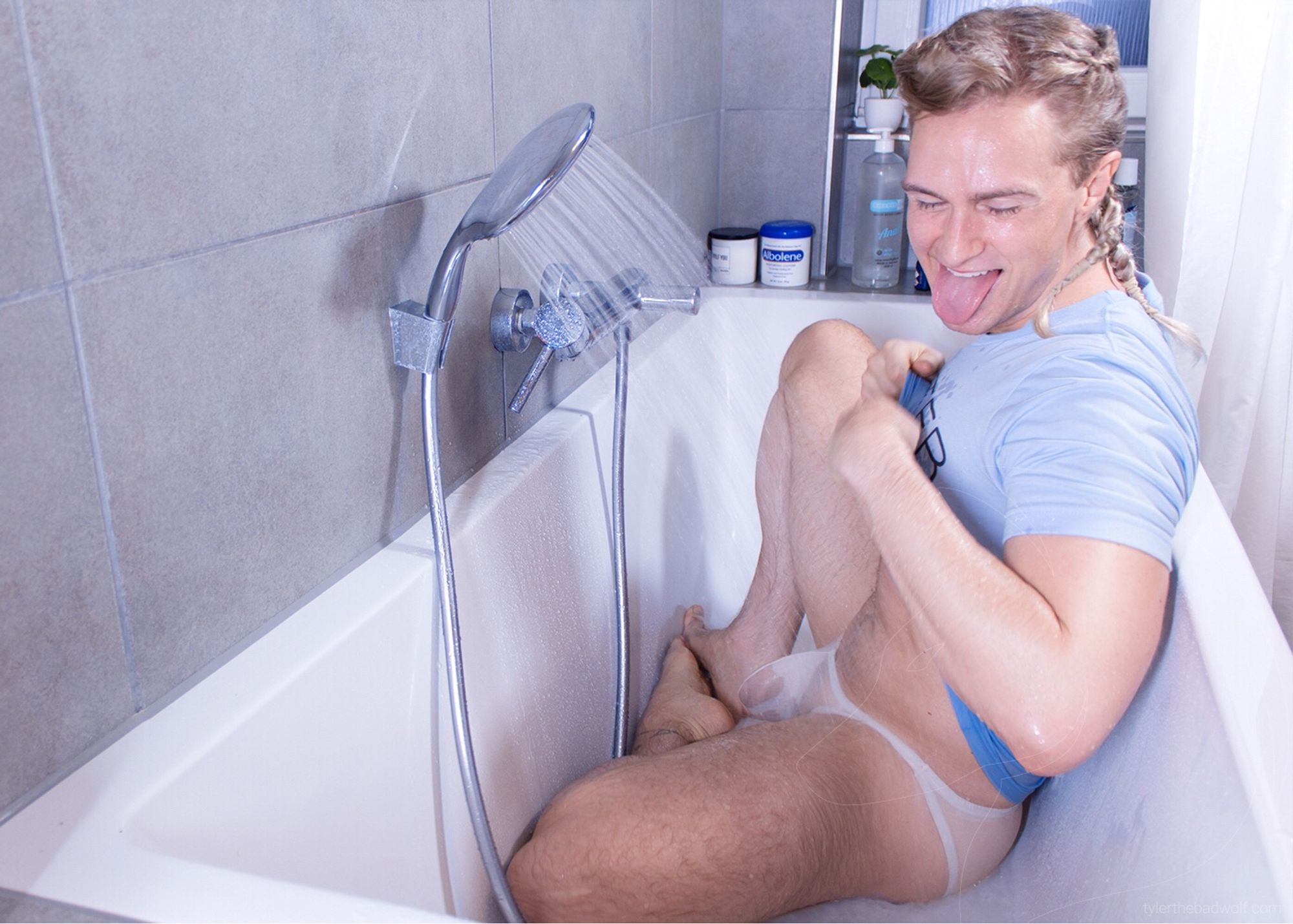 Tyler is silly in the bath in extremely see through pants.