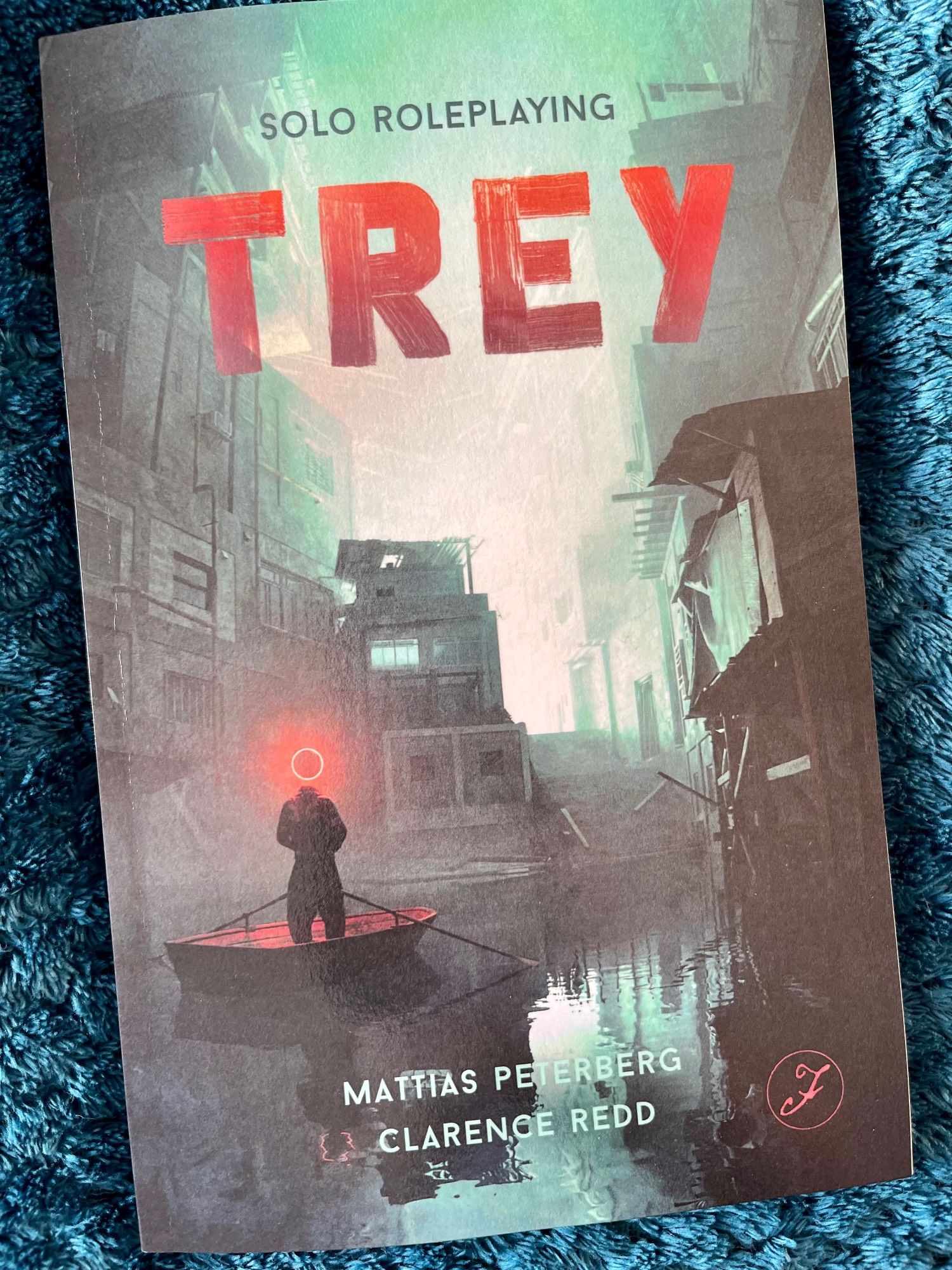 Printed copy of Trey by Mattias Peterberg and Clarence Redd, photographed on a fluffy throw.