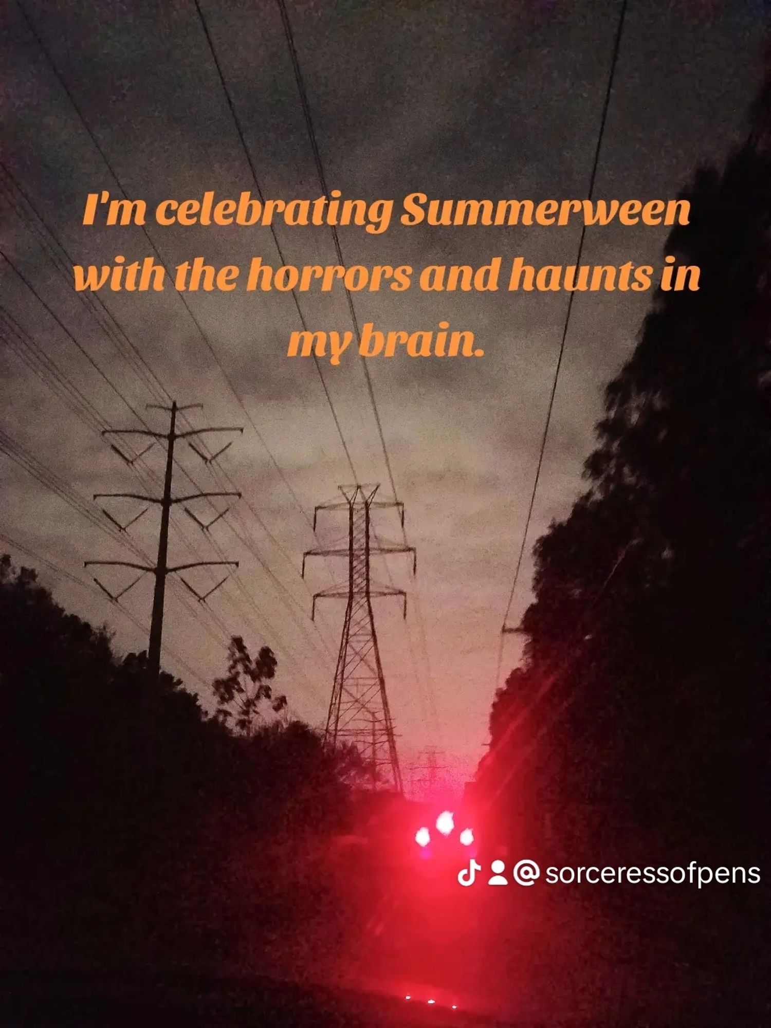 Picture of red car brake lights glowing beneath power lines. Text reads: I'm celebrating Summerween with the horrors and haunts in my brain.