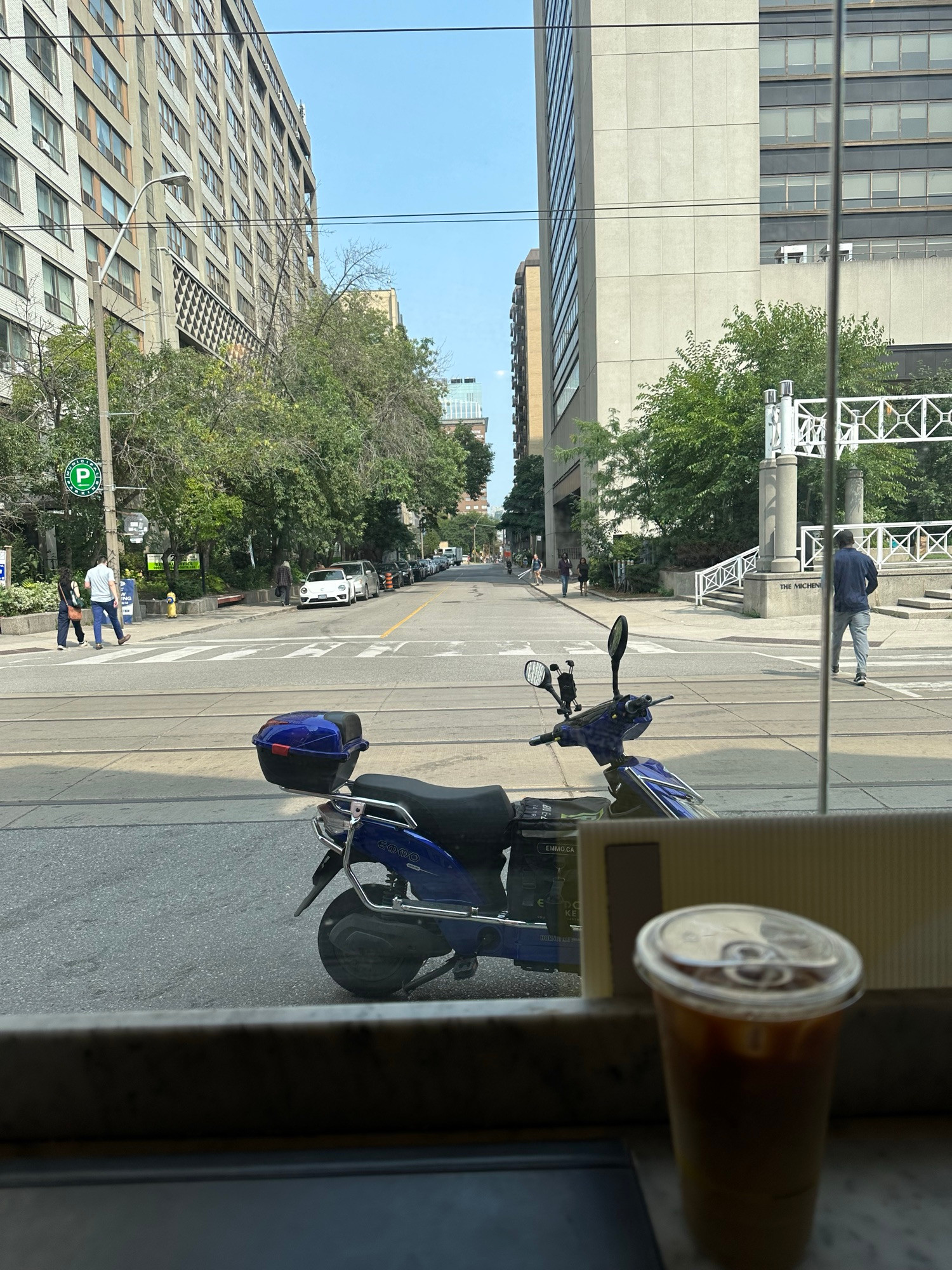 I’m at the window counter in Jimmy’s on McCaul looking down Elm Street. It’s nice out, but a bit too balmy to sit out in the sun. 