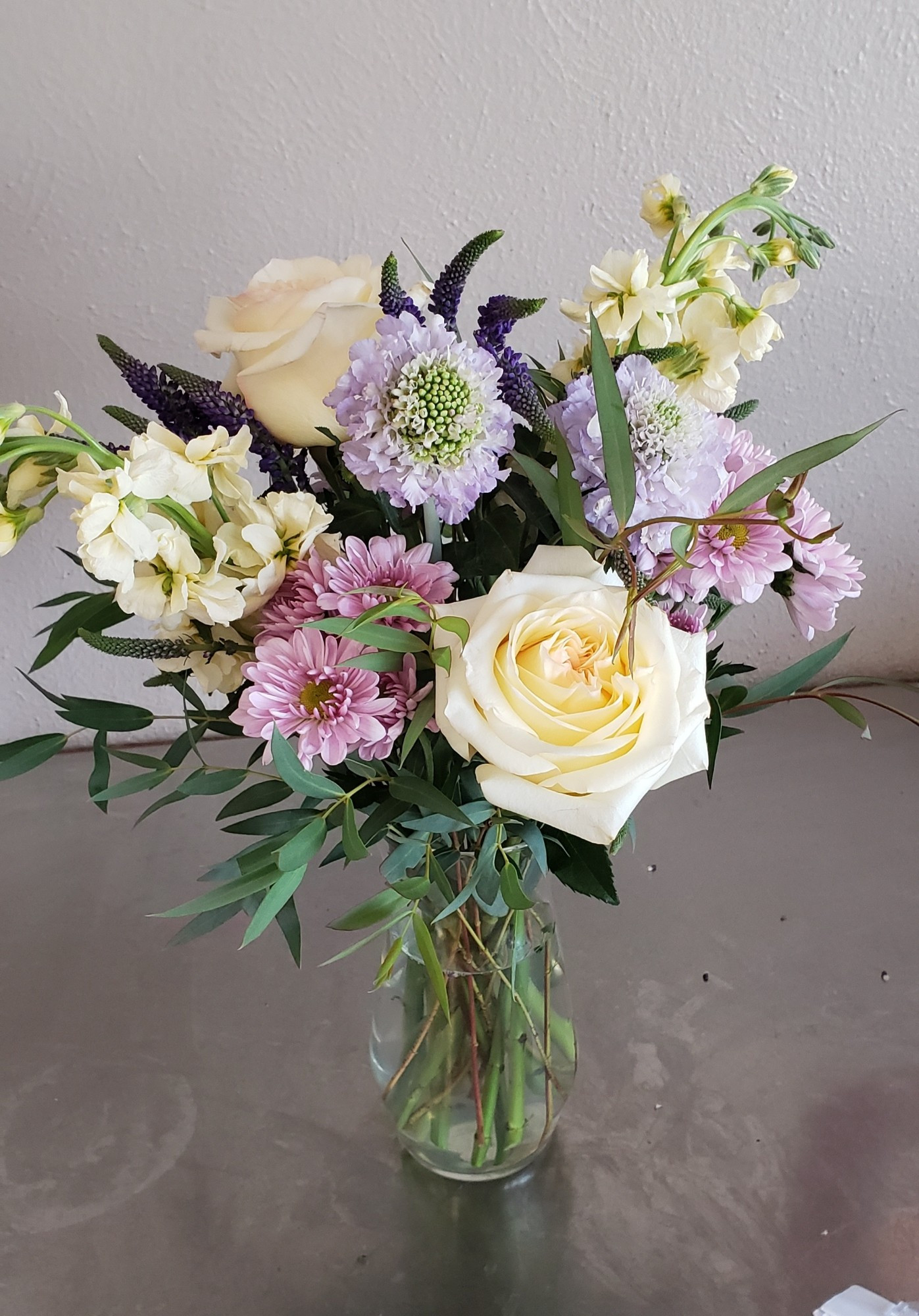 Vase arrangement of soft color flowers