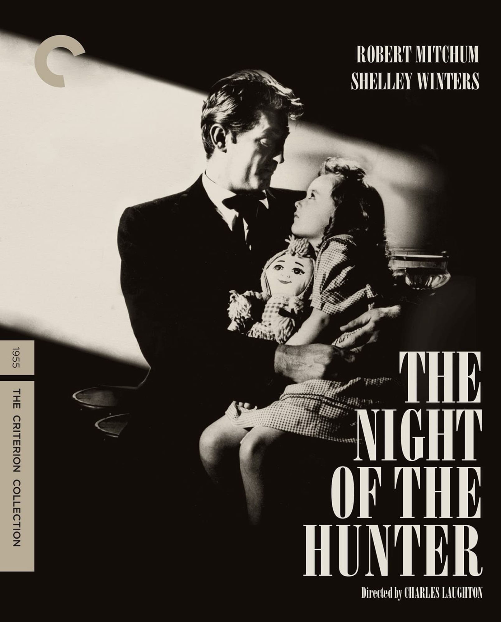 The Criterion Collection version of the movie poster, shrouded in darkness except a small shaft of light on Sally Jane Bruce as Pearl Harper sitting on Robert Mitchum’s lap.