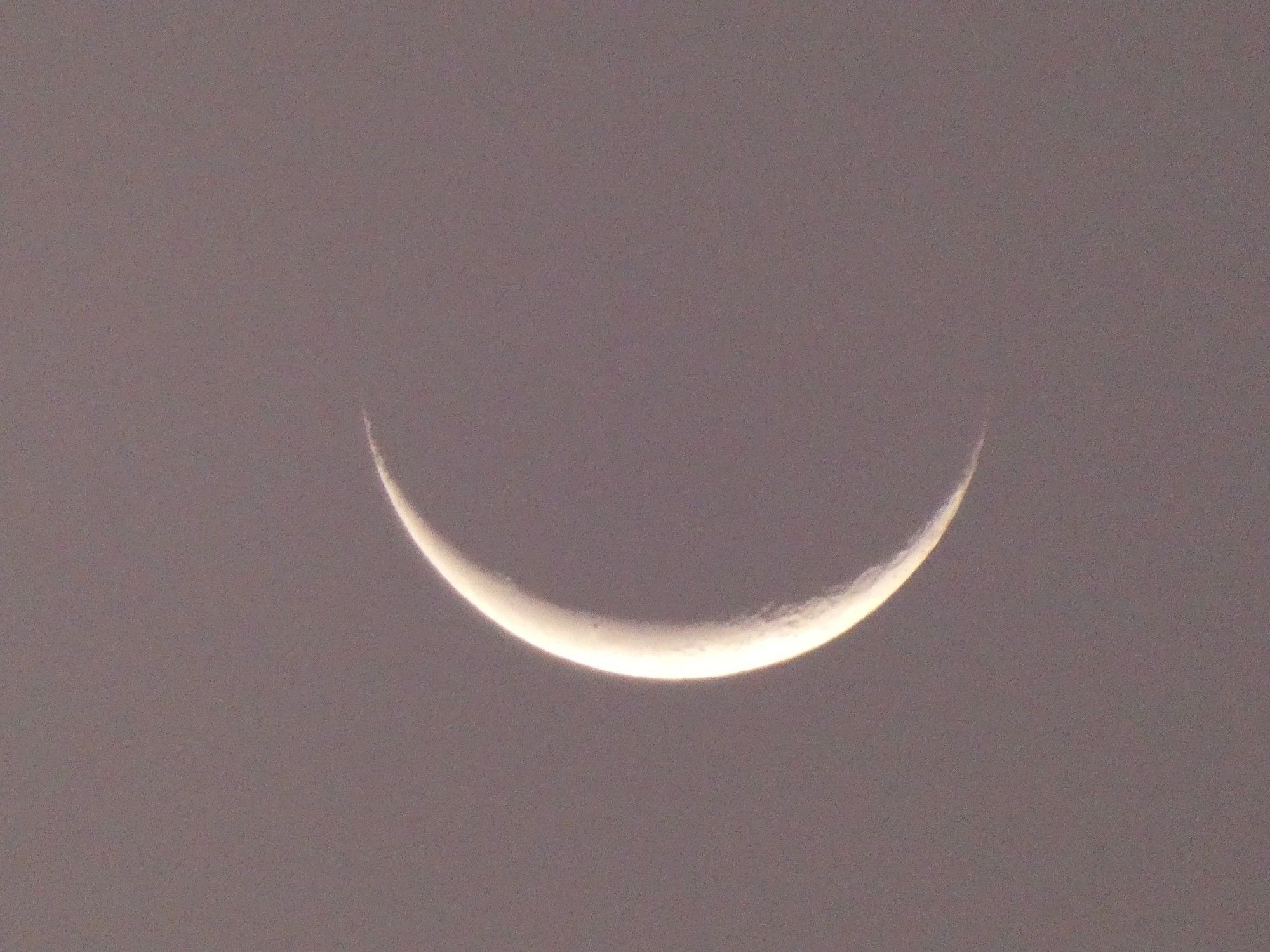 moon this morning, looking like a smile, just like the cheshire cat in "Alice in Wonderland"