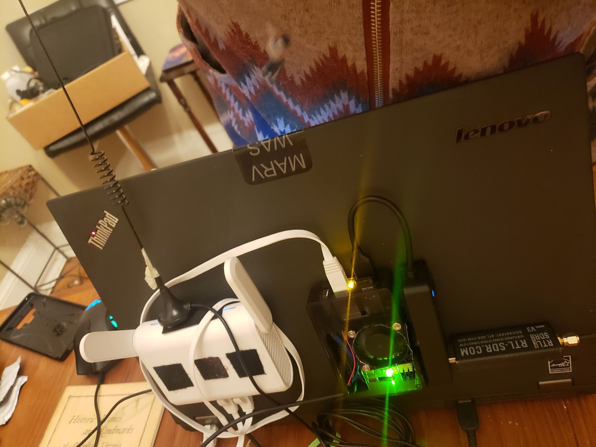 thinkpad with glinet router, orangepi3 ,and sdr veclro'd to the lid