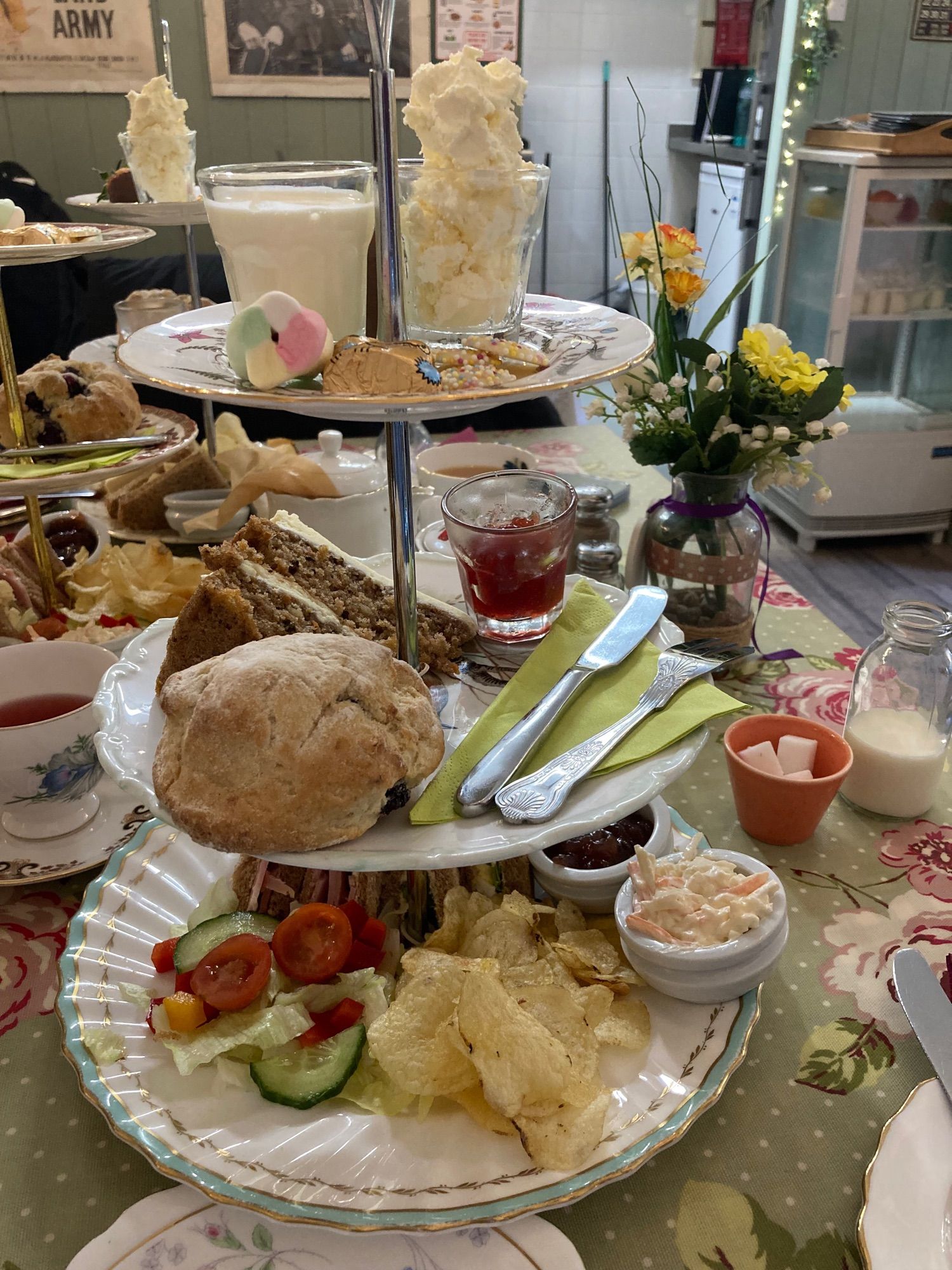 Tiered China cake stand with sandwiches cakes scones