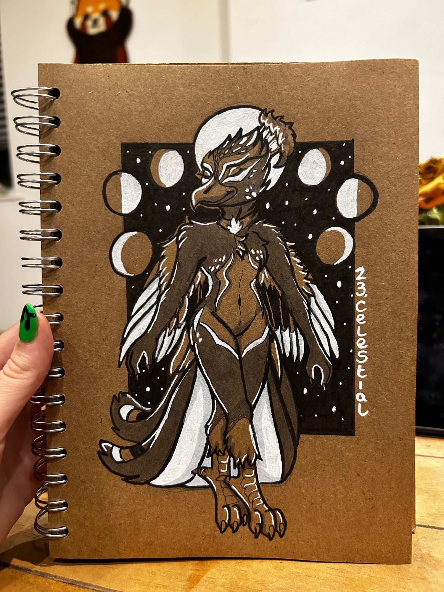 Monochrome ink drawing on brown paper of a peacock Phoenix hybrid surround by stars and moon phases for inktober prompt 23 Celestial 