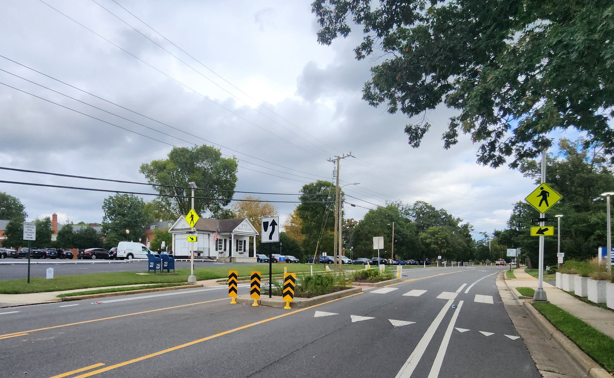 The Seminary Road pedestrian median refuge island and protected bike lane infrastructure in the vicinity appear undamaged.