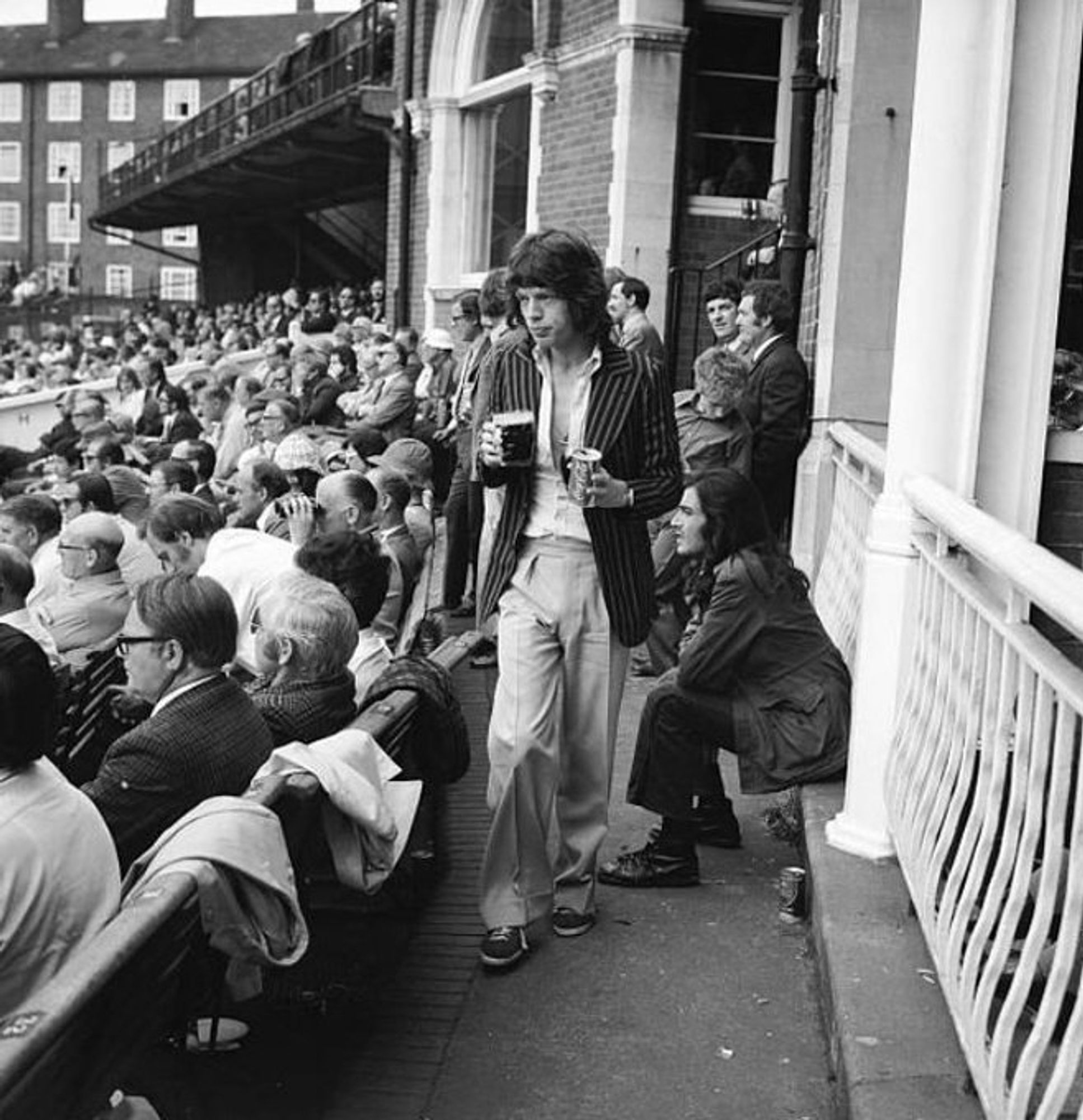 Mick Jagger watches the Ashes Test from the pavilion at The Oval in August 1972 almost unnoticed. The Stones were, at the time, one of the biggest bands in the world but the cult of celebrity had not reached the stage where he could no longer do this without being mobbed