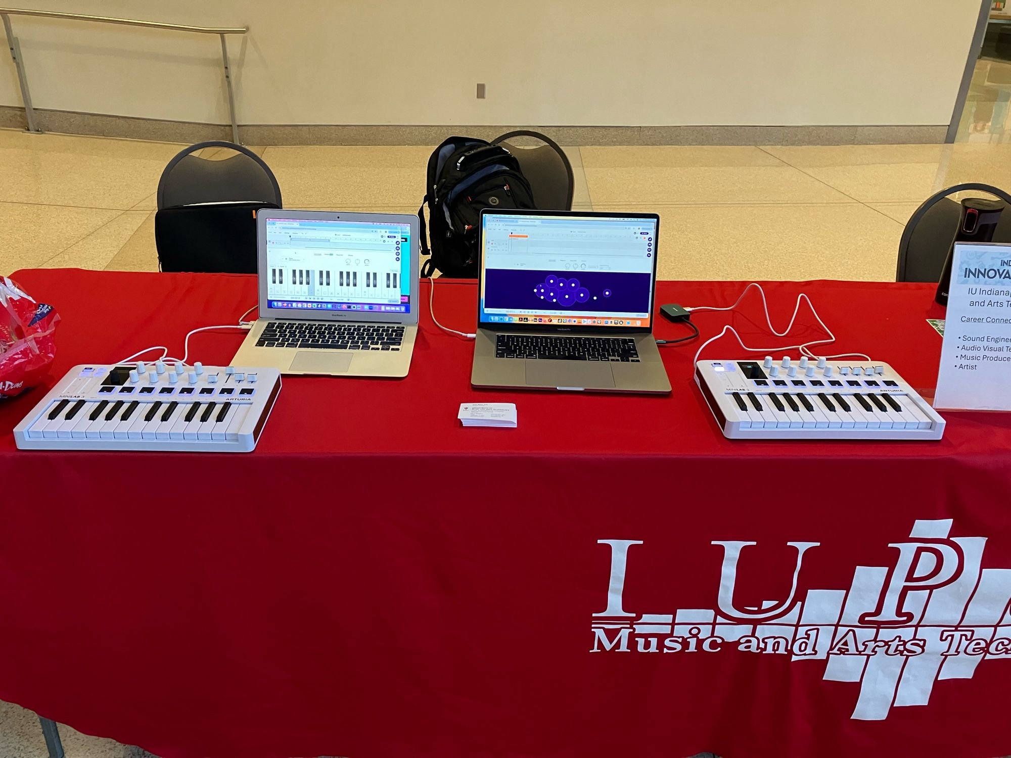 Two laptops with MIDI keyboards.