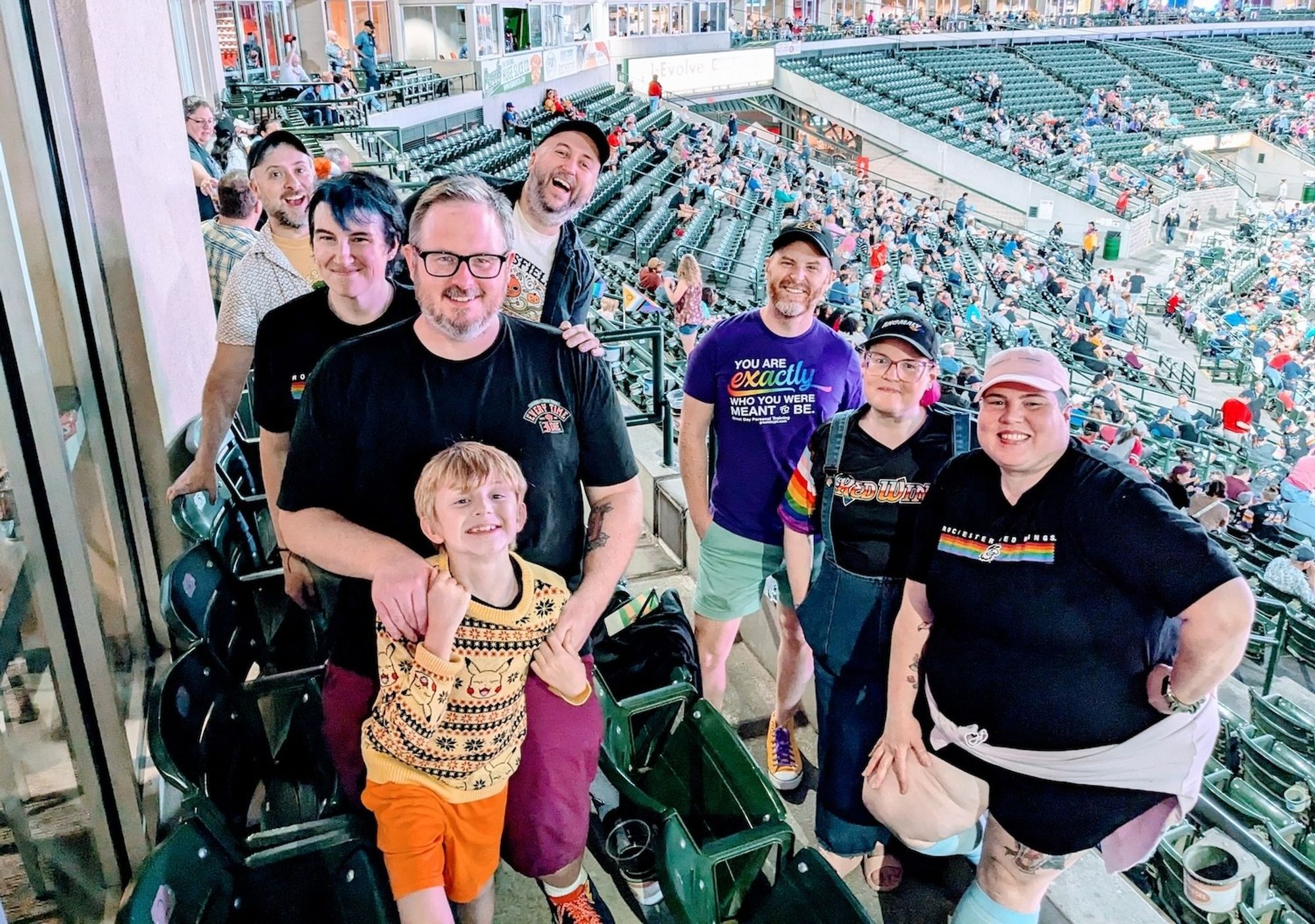 Group photo on a suite balcony overlooking the park.