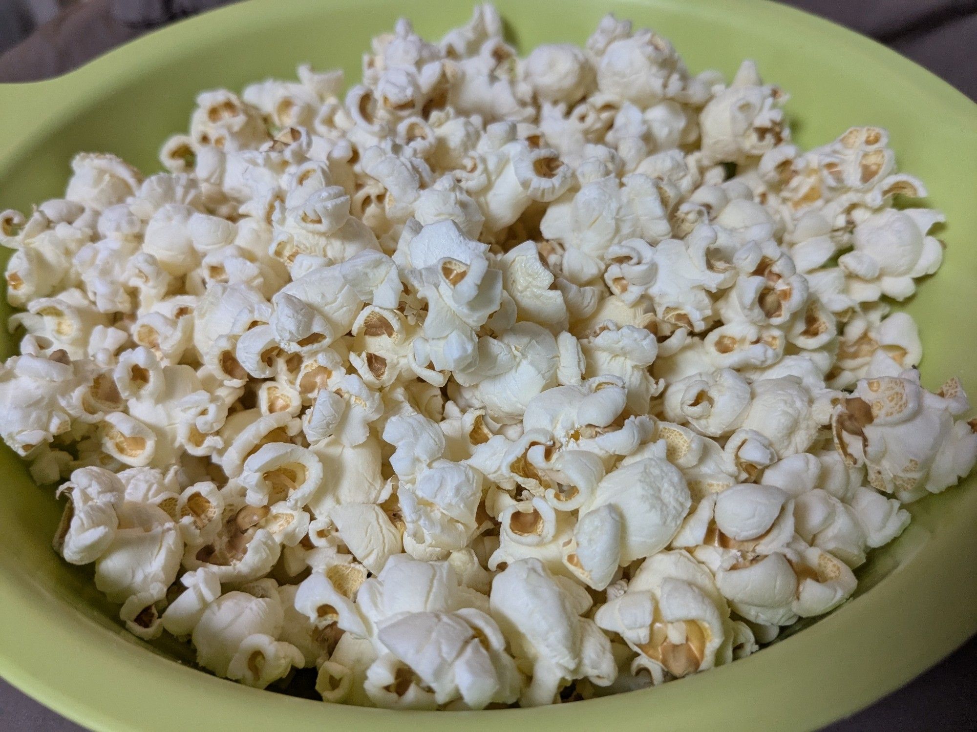 Popcorn in a yellow-lime bowl