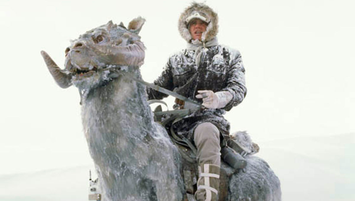 Han Solo, covered in snow, astride a Tauntaun