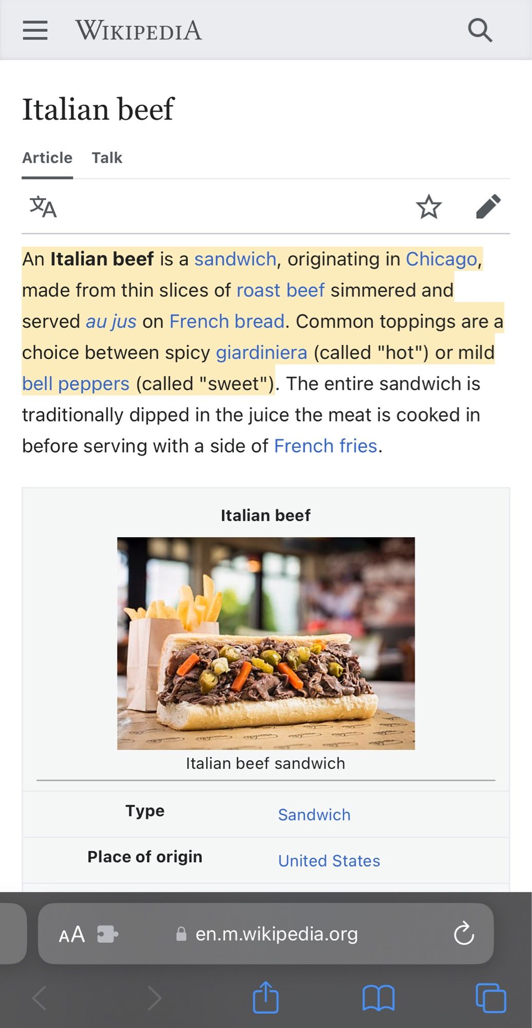 Screenshot of Safari for iPhone showing the Wikipedia page for Italian beef, with the first two sentences highlighted in yellow