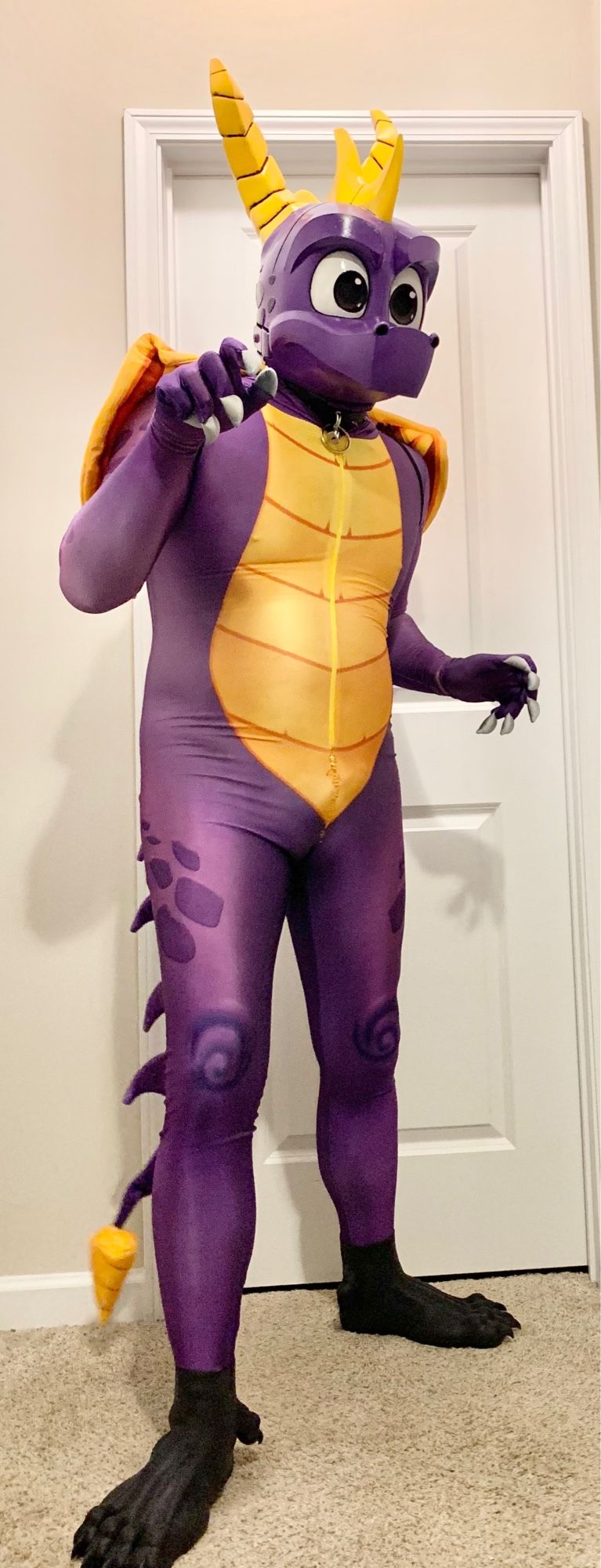 Spyro the Dragon cosplay consisting of a spandex bodysuit and 3D-printed helmet/mask.