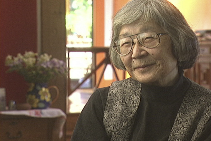 Hisaye Yamamoto smiling during an interview conducted by sisters Emiko and Chizuko Omori for their 1999 documentary, Rabbit in the Moon.