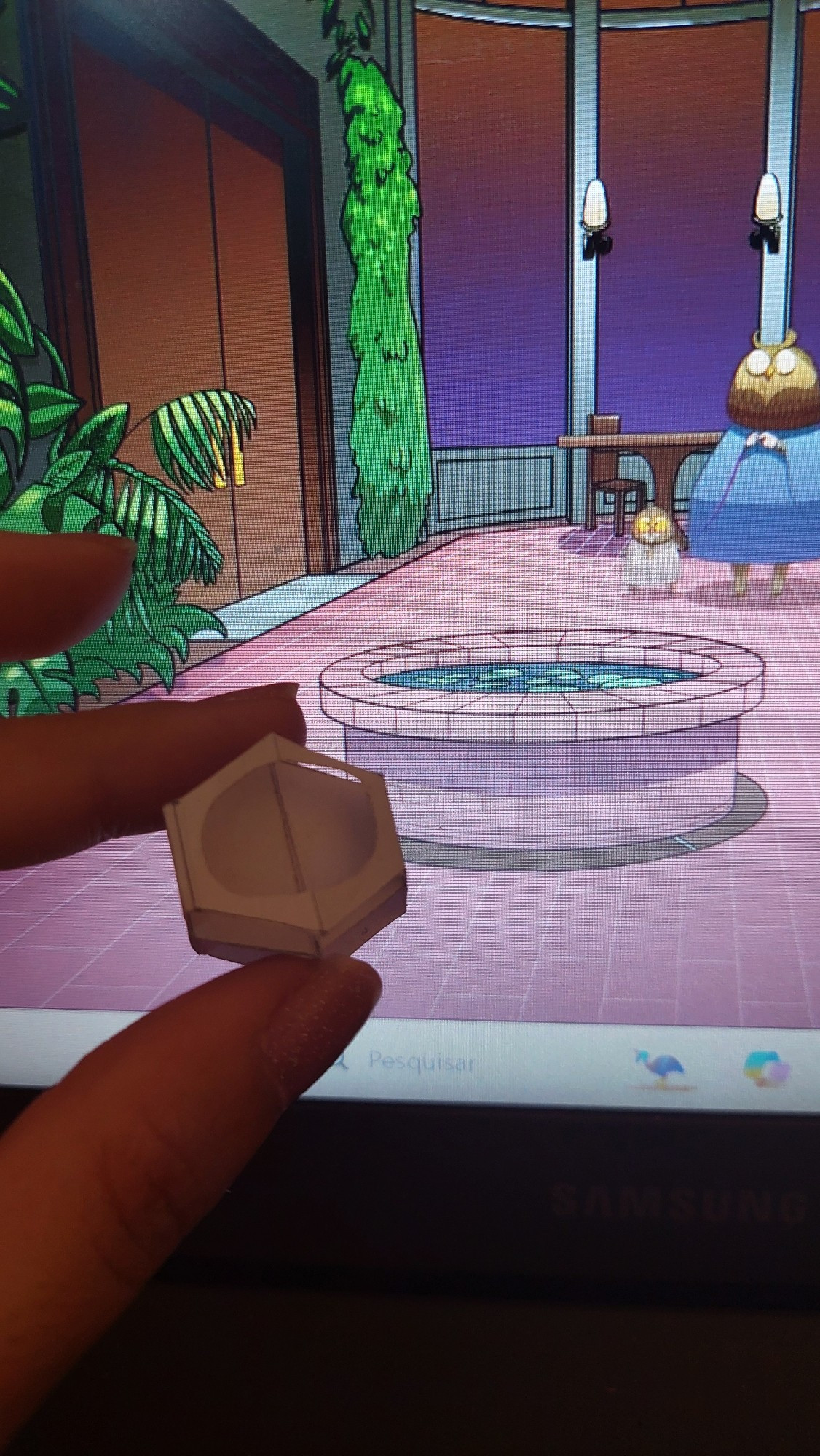 A small paper mockup of a pop-up well in front of the drawing of the Conservatory room from Drawtectives S1