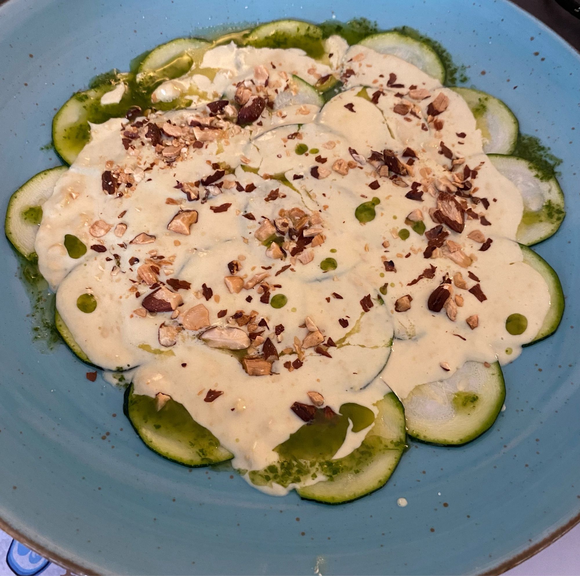 Zucchini slices with a sauce of mustard and roasted almonds