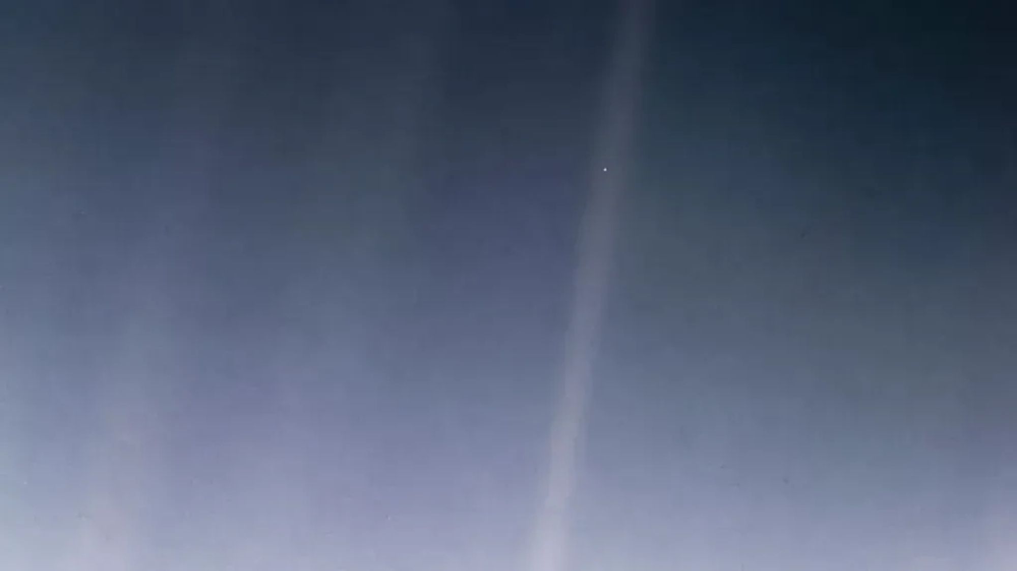 The Pale Blue Dot image: an image of Earth taken from the edge of our solar system by the Voyager 1 spacecraft of February 14, 1990. More at https://science.nasa.gov/resource/voyager-1s-pale-blue-dot/