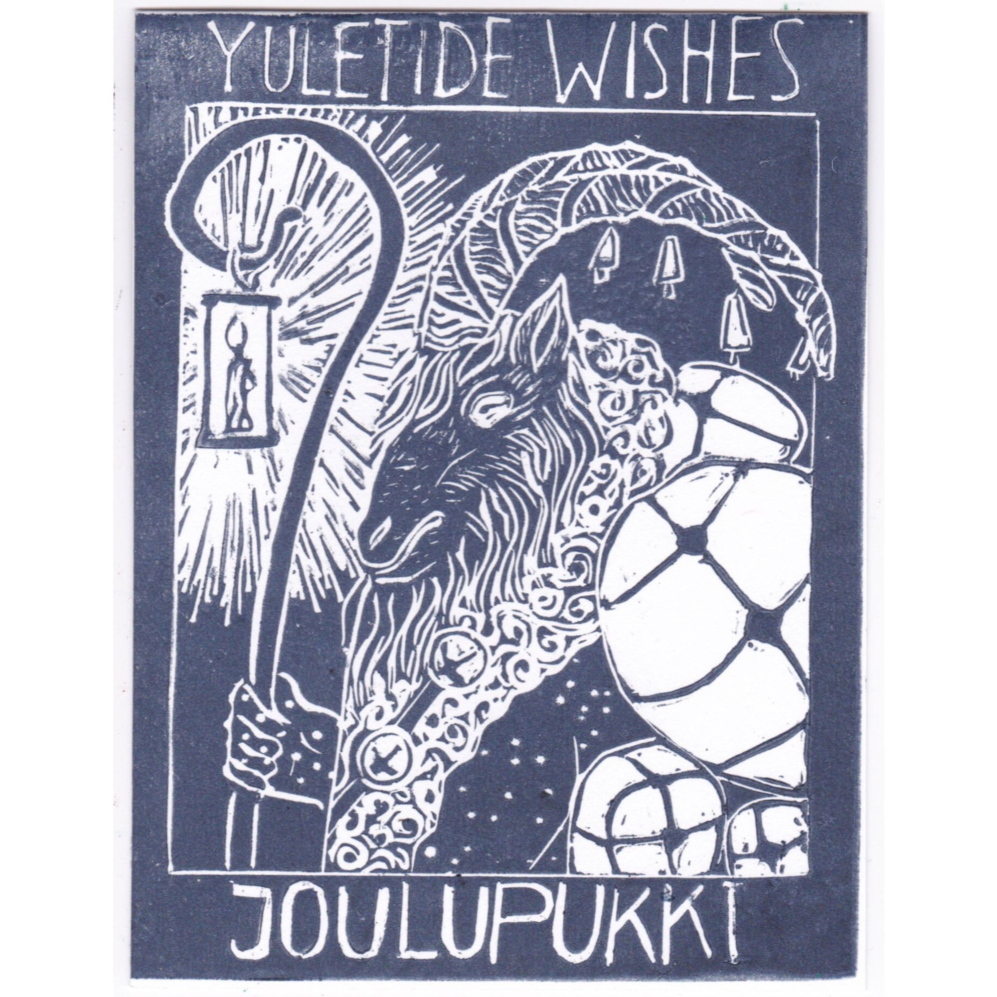 My linocut print of goat-headed man with a candle in a lantern on a shepherd’s crook in a large coat with  bells carrying many packages tied with string. It’s printed in dark blue ink. Above it reads “Yuletide Wishes” and below “Joulupukki”.